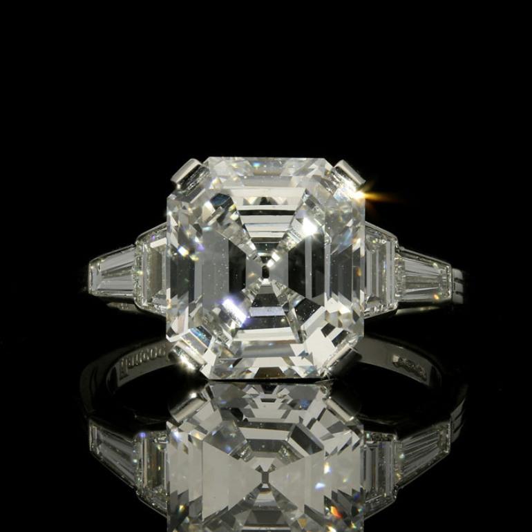 5.08ct D VS2 asscher cut diamond with GIA certificate
2 trapezoid and 2 tapered baguette cut diamonds weighing a combined total of 0.60cts
Platinum with maker's marks and London assay marks
UK finger size M, US size 6.5, can be adjusted to your own