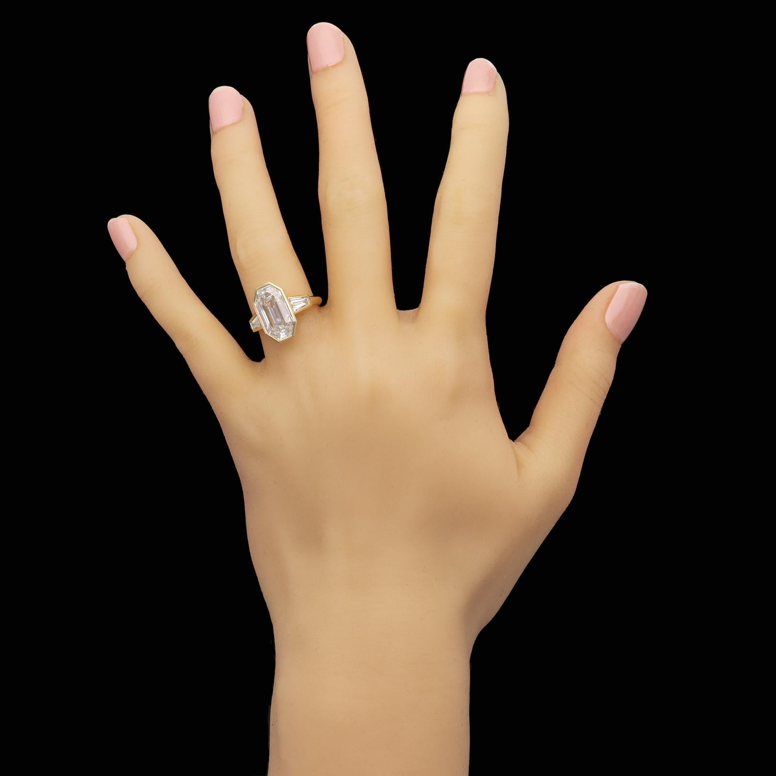 bezel set emerald engagement ring
