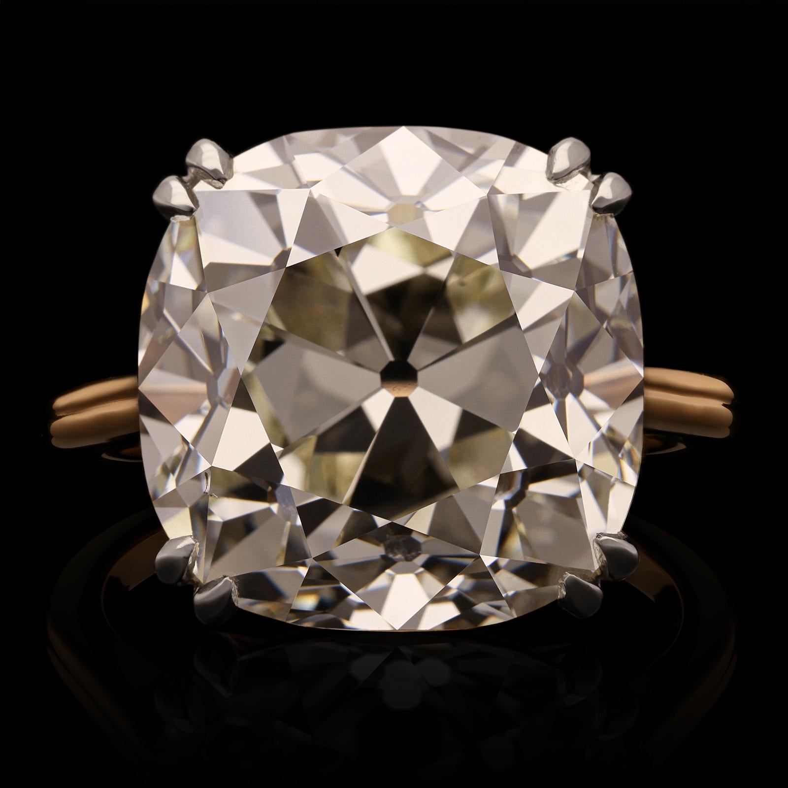 A classic diamond, platinum and 18ct rose gold solitaire ring by Hancocks, set with a magnificent bright and lively old mine brilliant cut diamond weighing 13.06cts and of N colour and VS2 clarity in a double corner claw platinum setting with