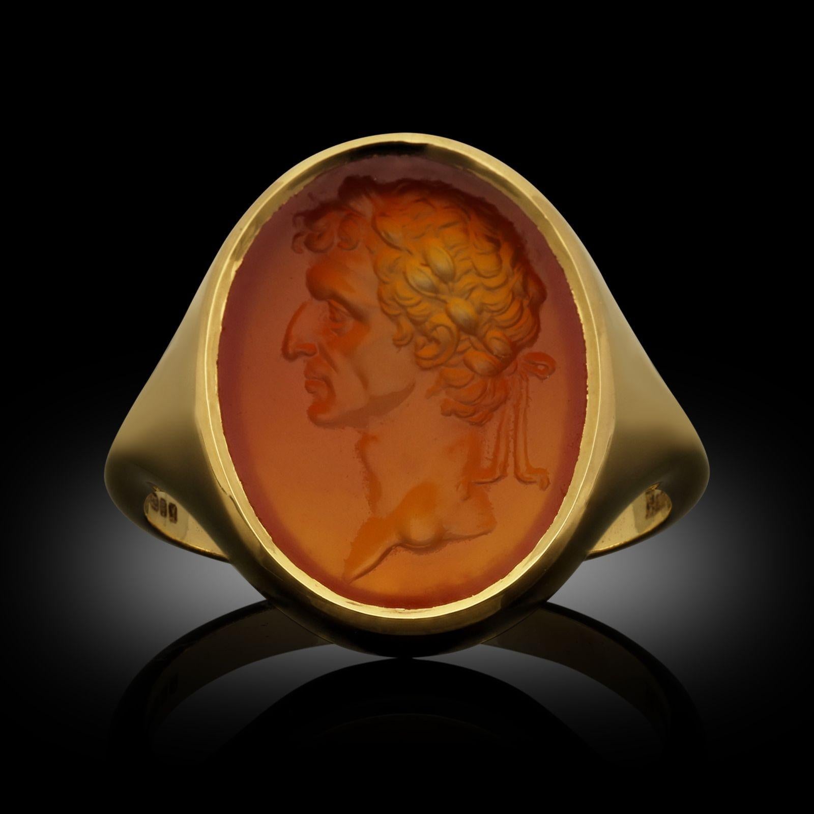 A gold and carnelian signet ring by Hancocks, the classic oval shaped signet ring handmade in 22ct yellow gold and set with an antique oval carnelian intaglio circa 1840 engraved with the profile of Roman general Julius Caesar, bezel set into the