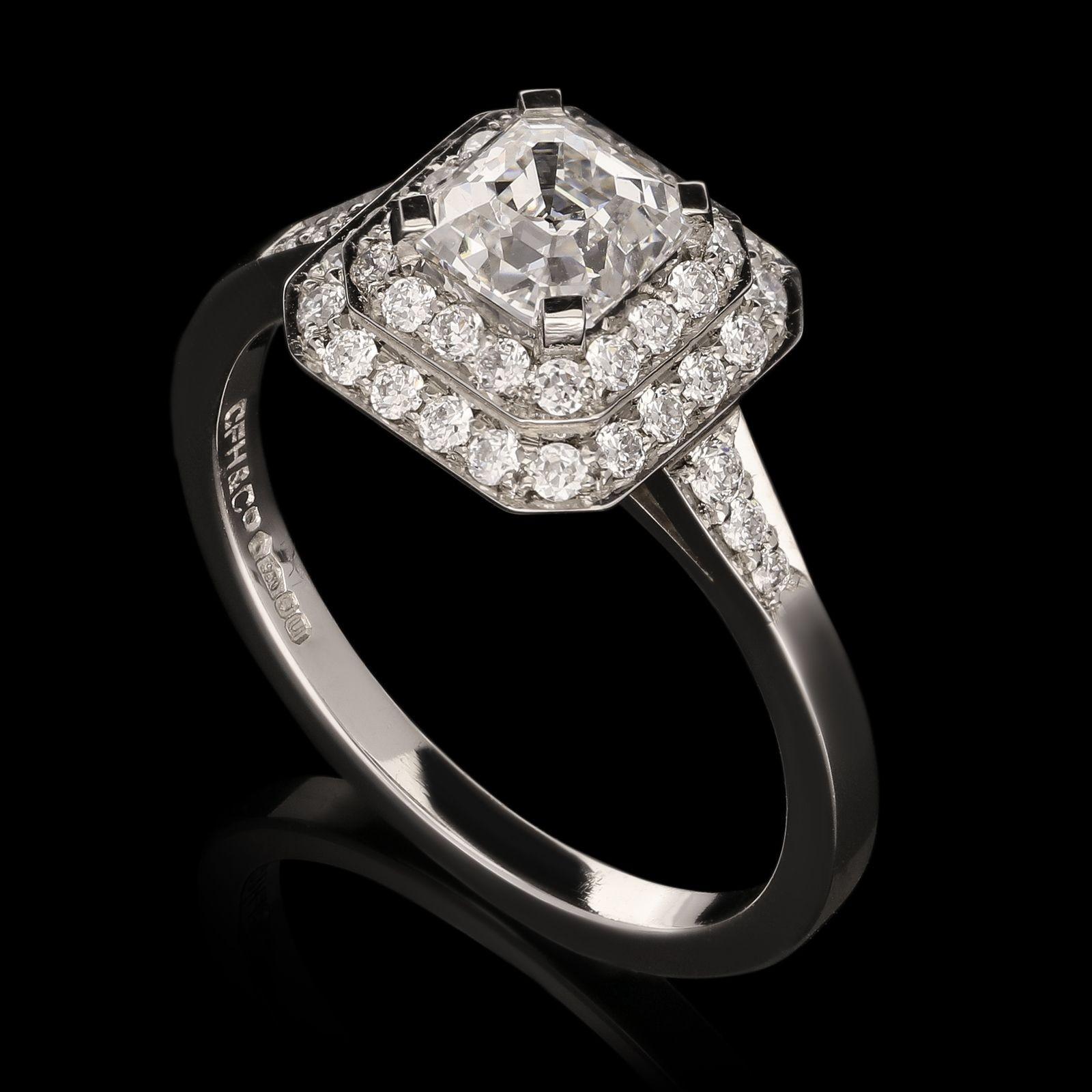 A beautiful diamond ring centred with a 0.85ct Asscher cut diamond in two tiered cluster surround

Hancocks, Contemporary

London

Setting Platinum with maker's mark and London assay marks

Gemstones and Other Materials

0.85ct E VS1 Asscher cut