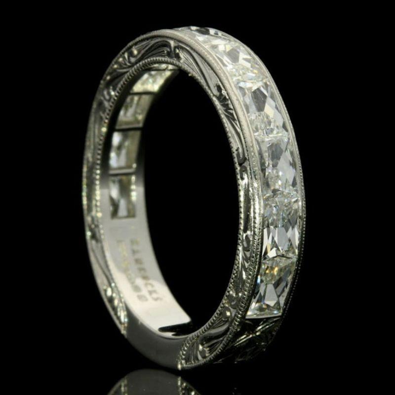 A stunning French-cut diamond and platinum eternity ring by Hancocks, the ring three quarter set with beautiful rectangular French cut diamonds weighing a total of 1.92cts and of G colour and VS clarity set horizontally within a finely crafted and