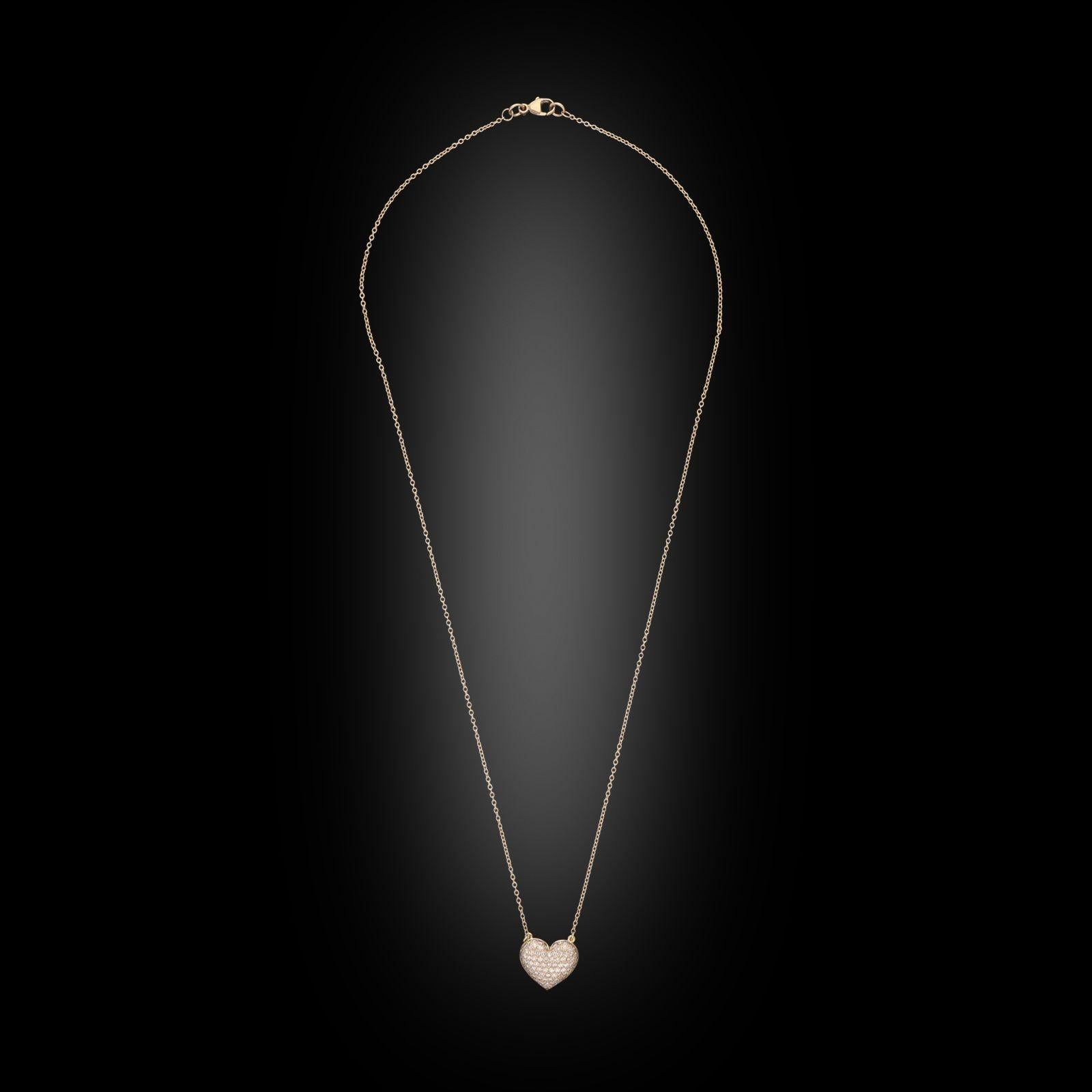 A pink diamond and rose gold heart shaped pendant by Hancocks, the heart with domed profile pavé set across the front with single cut pink diamonds in 18ct rose gold, suspended from a fixed 18” rose gold trace chain. This sweet pendant would make a