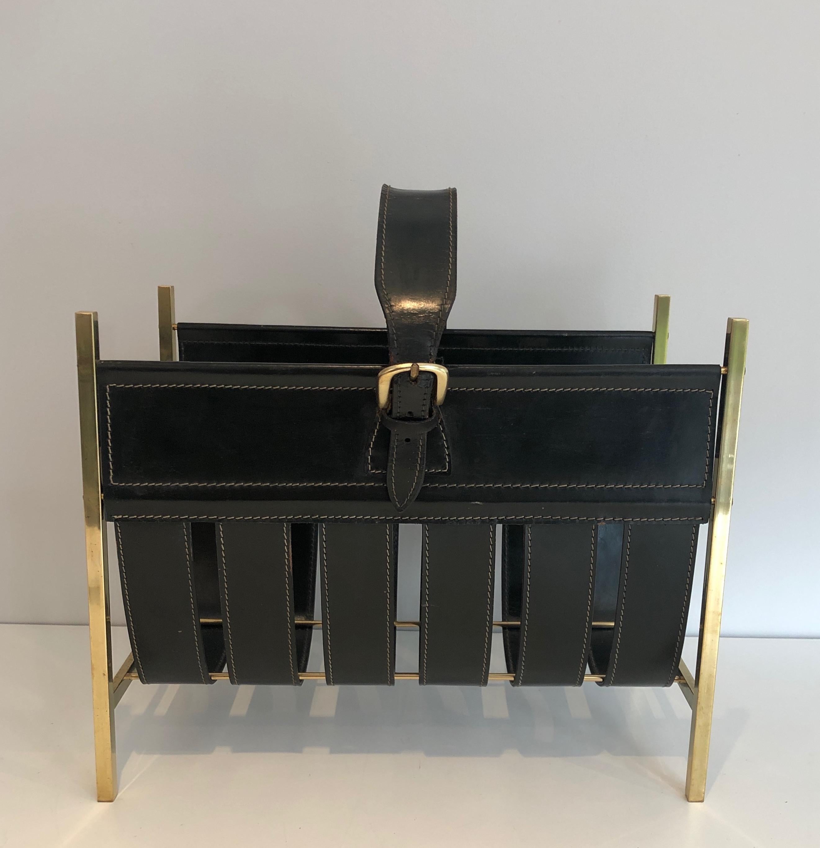 This beautiful hand-bag magazine rack is made of brass and leather. This is a work by famous French designerJacques Adnet. Circa 1940.
 