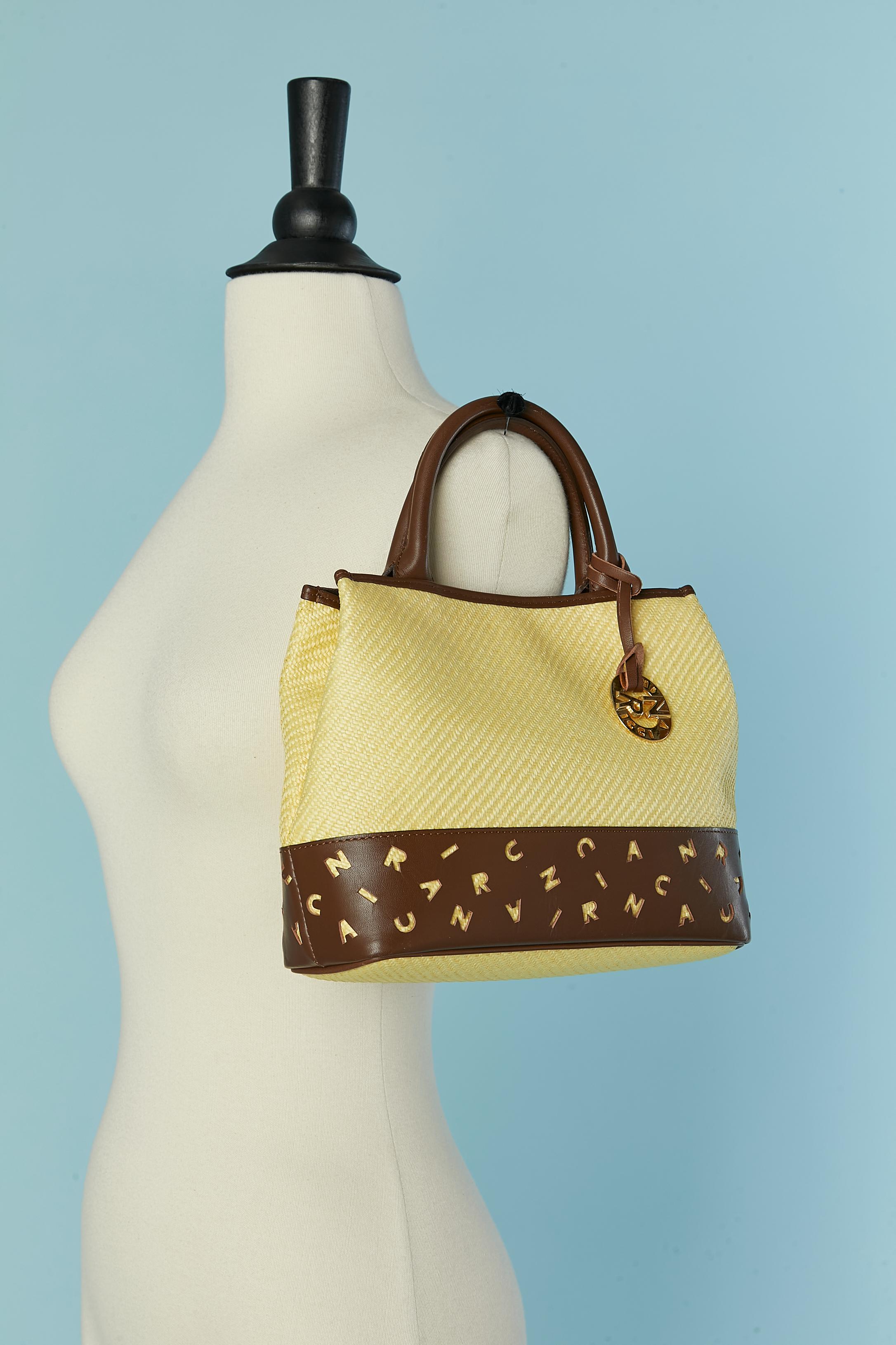 Women's Hand bag made of woven straw and laser-cut brown leather Nina RICCI For Sale