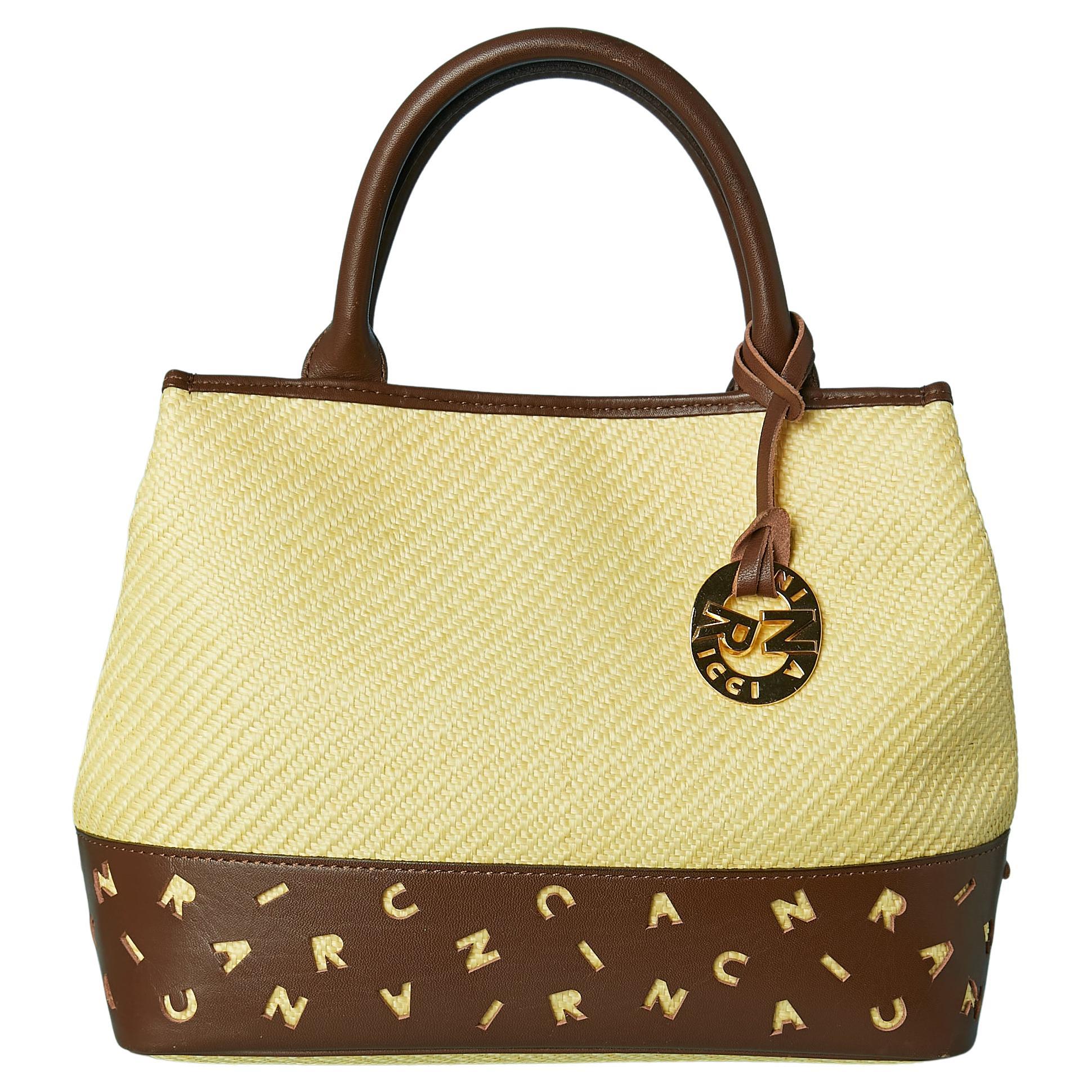 Hand bag made of woven straw and laser-cut brown leather Nina RICCI
