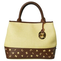 Hand bag made of woven straw and laser-cut brown leather Nina RICCI