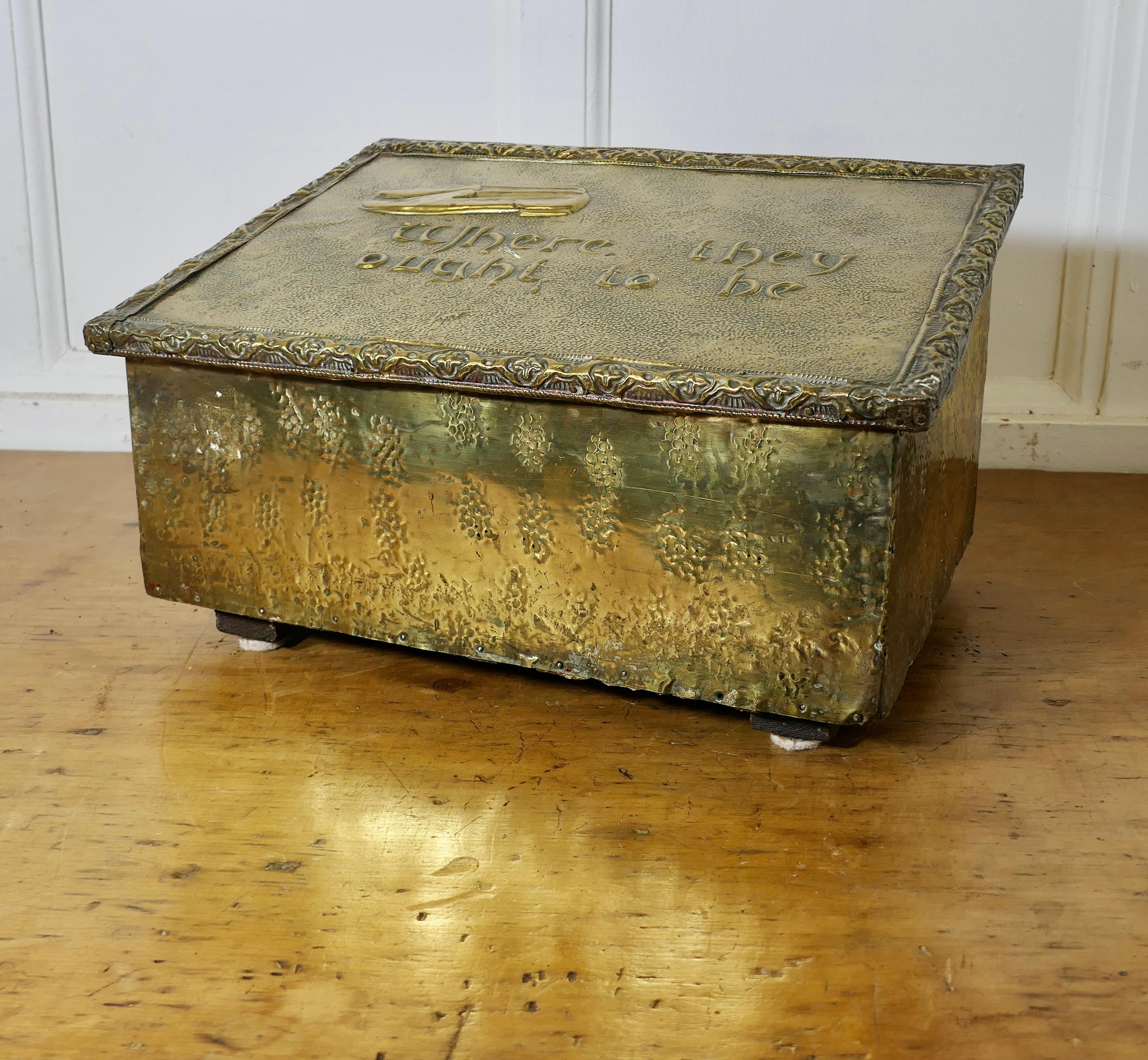 Hand Beaten Brass Fireside Slipper Box 

“Where they ought to be” the jolly if old fashioned motif on the front of the very useful box
A super little piece and so useful, this box would have been kept by the fireside not only does it keep your