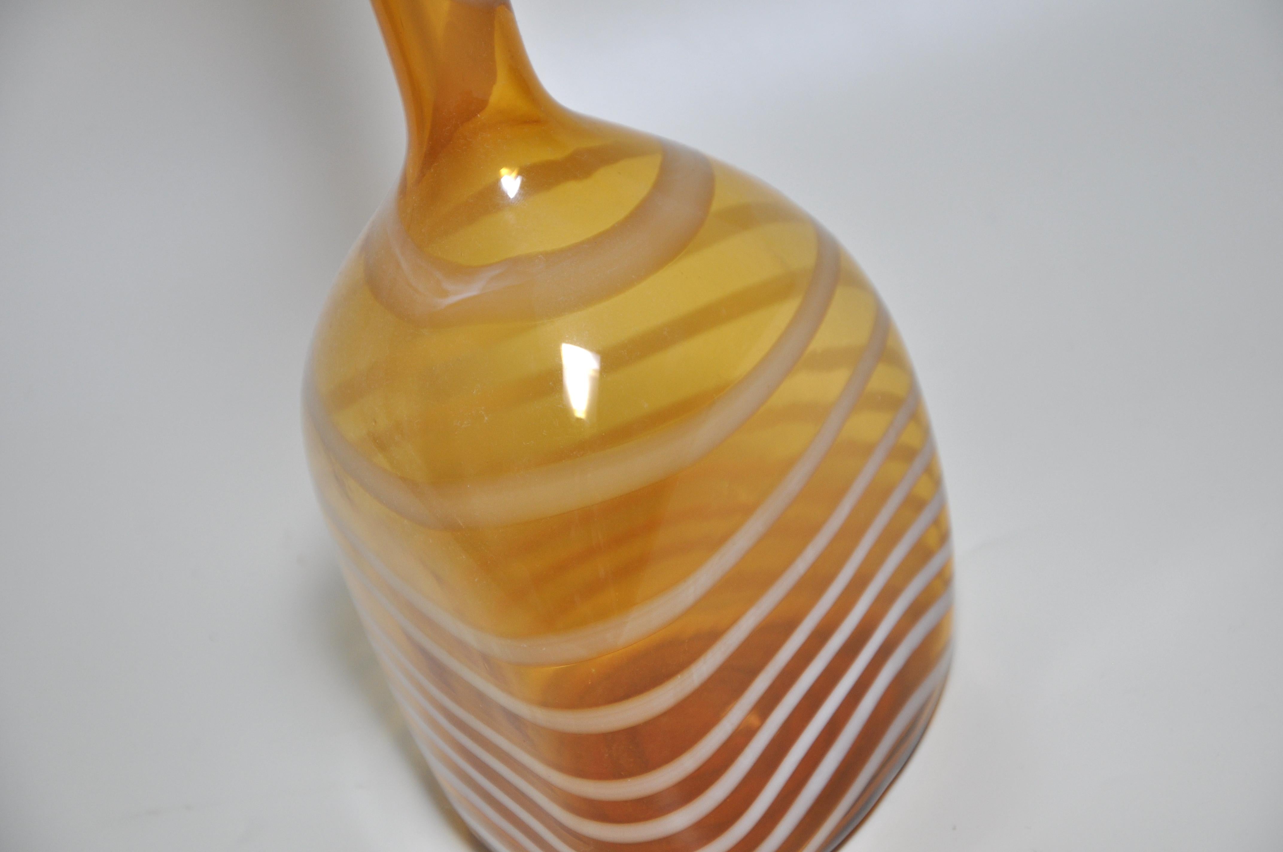 Title:
Hand Blown Art Glass Mustard Large Yellow Ochre White Vase Pot Bottle


Description:

Very striking an unusual unique vintage art piece. A dramatic accent to ones interior.

The base shows that it has been hand blow (as the glass is cut off),