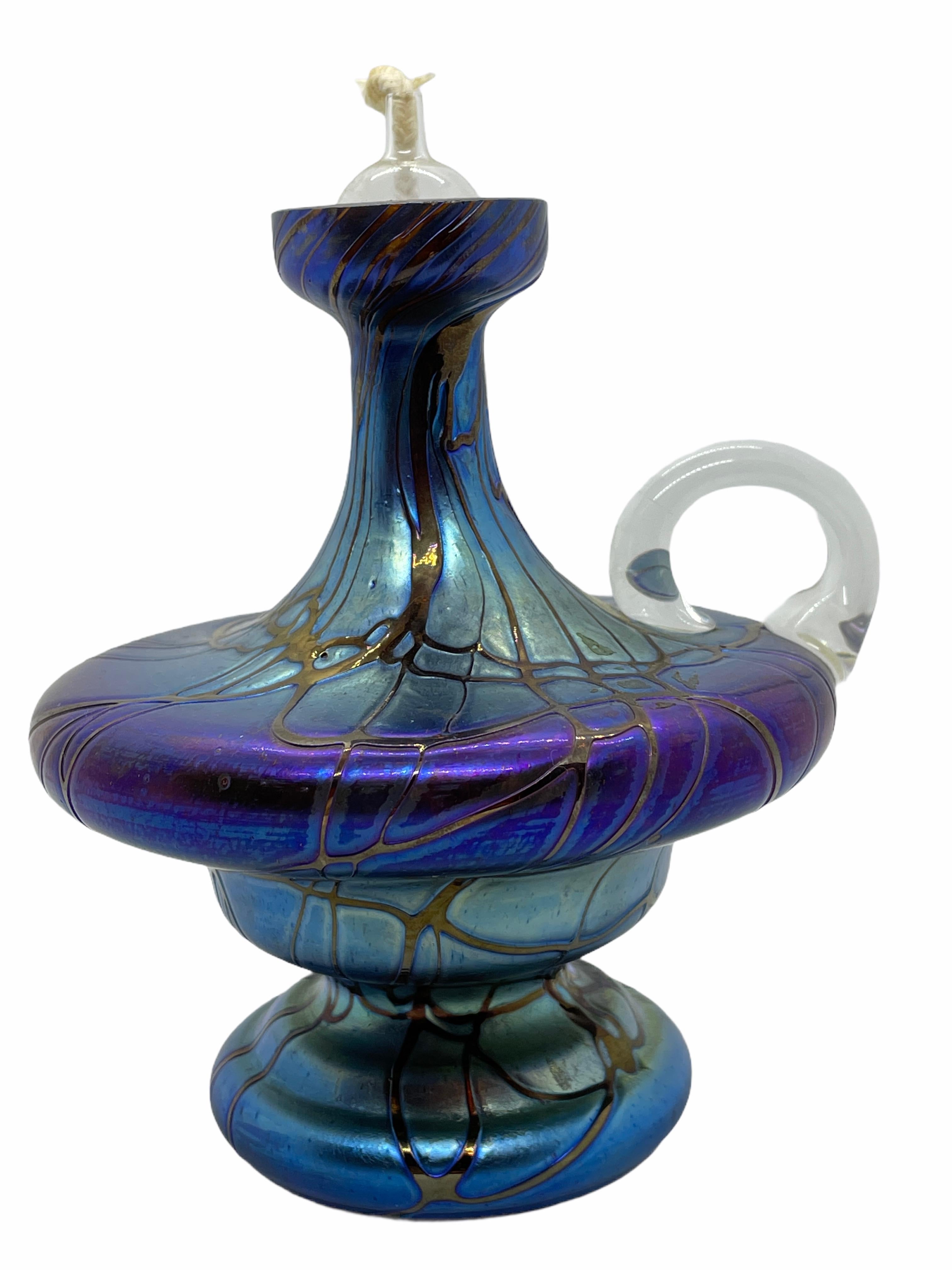 An amazing luster glass oil lamp, Germany, circa 1970s. Lamp is in very good condition with no chips, cracks, or flea bites.