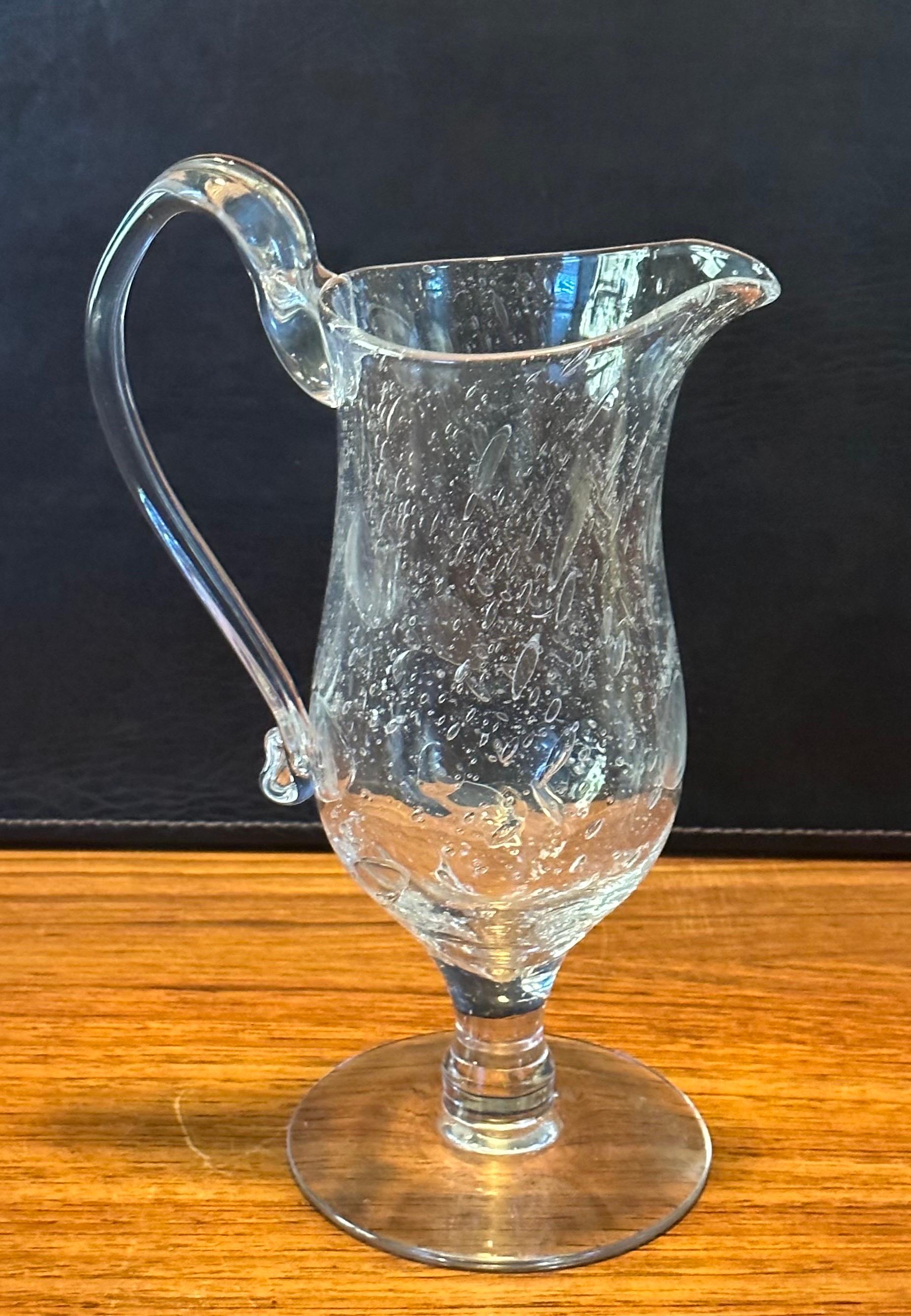 Hand blown crackled clear glass ewer / pitcher by Blenko Glass, circa 1990s. The piece is in very good vintage condition and measures 7