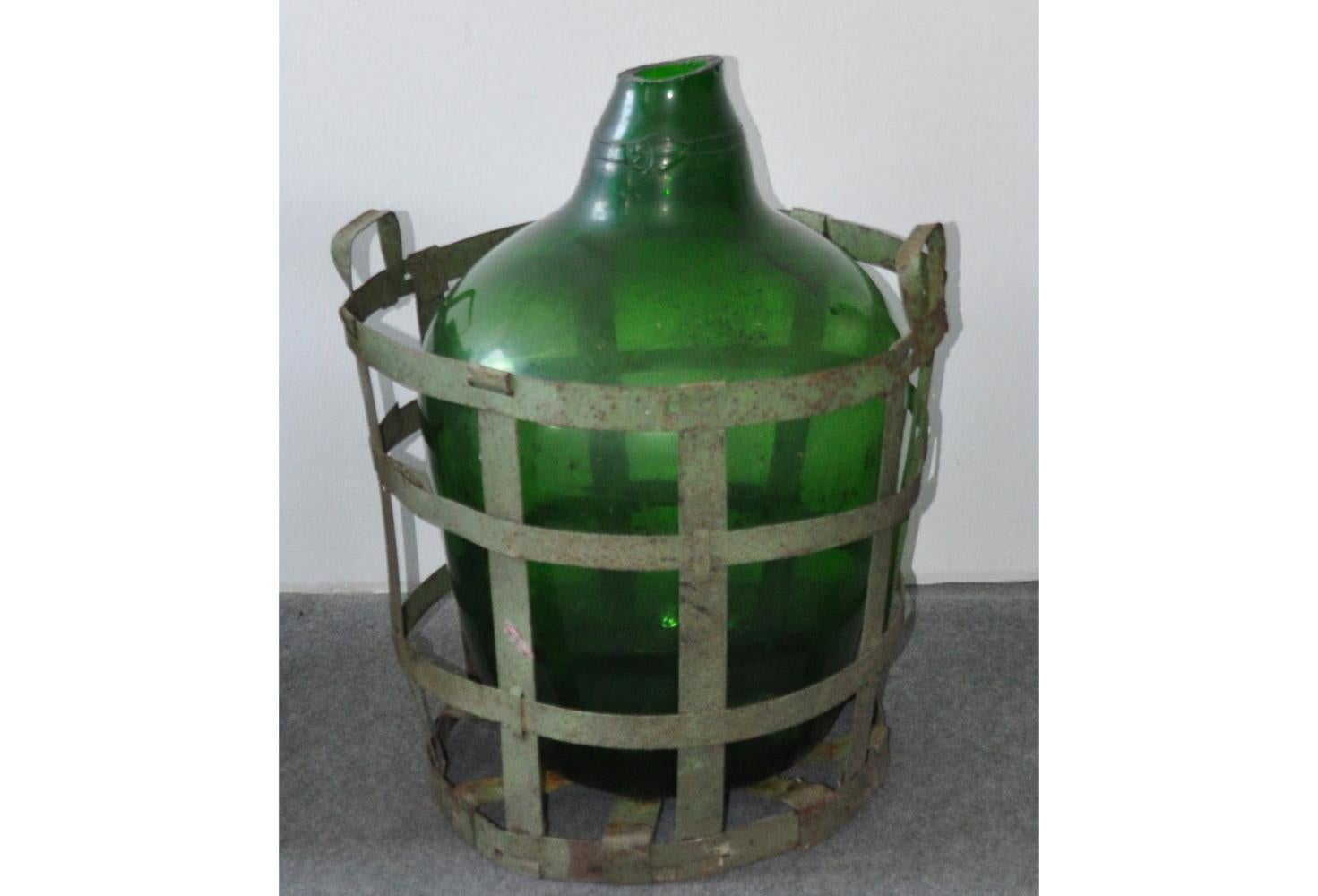 This authentic antique bottle was hand blown green glass and sits within a weathered iron basket.
Iron basket with demijohn wine bottle.

Available:4 st


Dimensions: 27.56 in
Diameter 21.26 in.
 