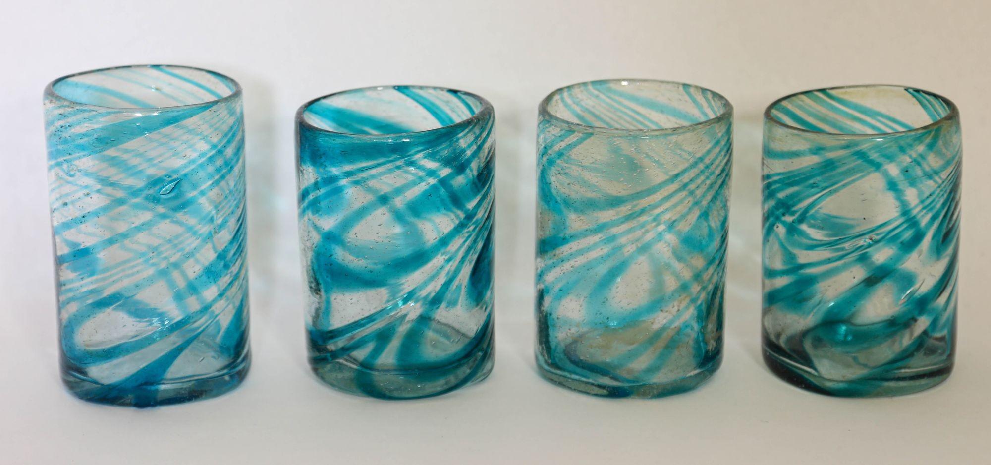 Hand Blown Drinking Glasses Handcrafted Blue Swirl set of 4.
Each of these glasses are handcrafted by Mexican Artisans.
As these are individually made none of them are exactly the same, they may show slight variations in shape, size and color so it
