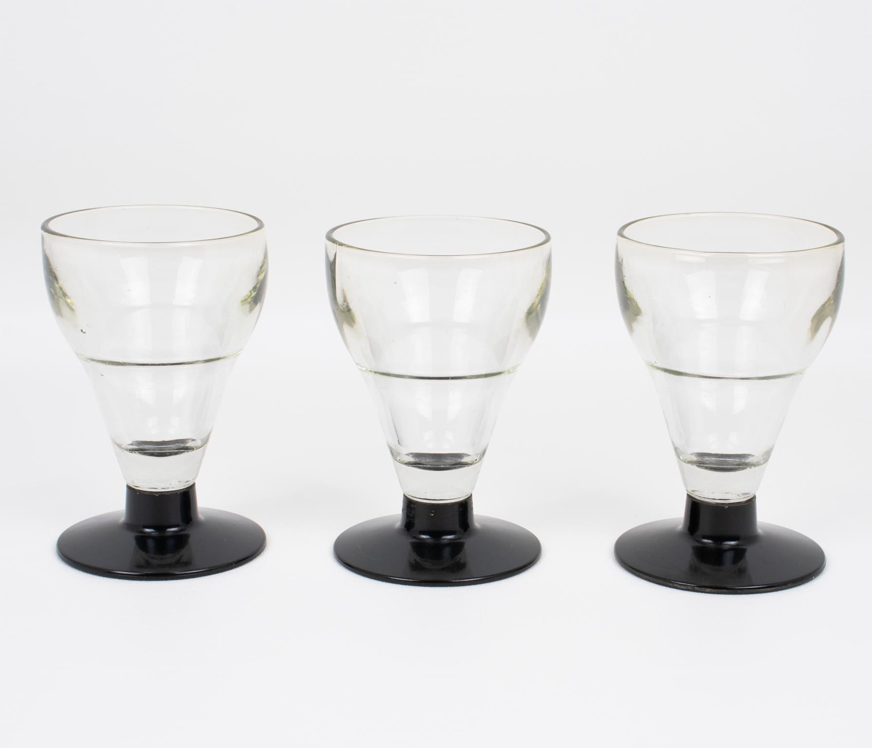 This authentic set of three French Absinthe glasses was manufactured by Franckhauser in Lyon, France, circa 1910. 
These heavy glasses were used in French bistros, bars, or cafes in the ritual of drinking the addictive beverage called 