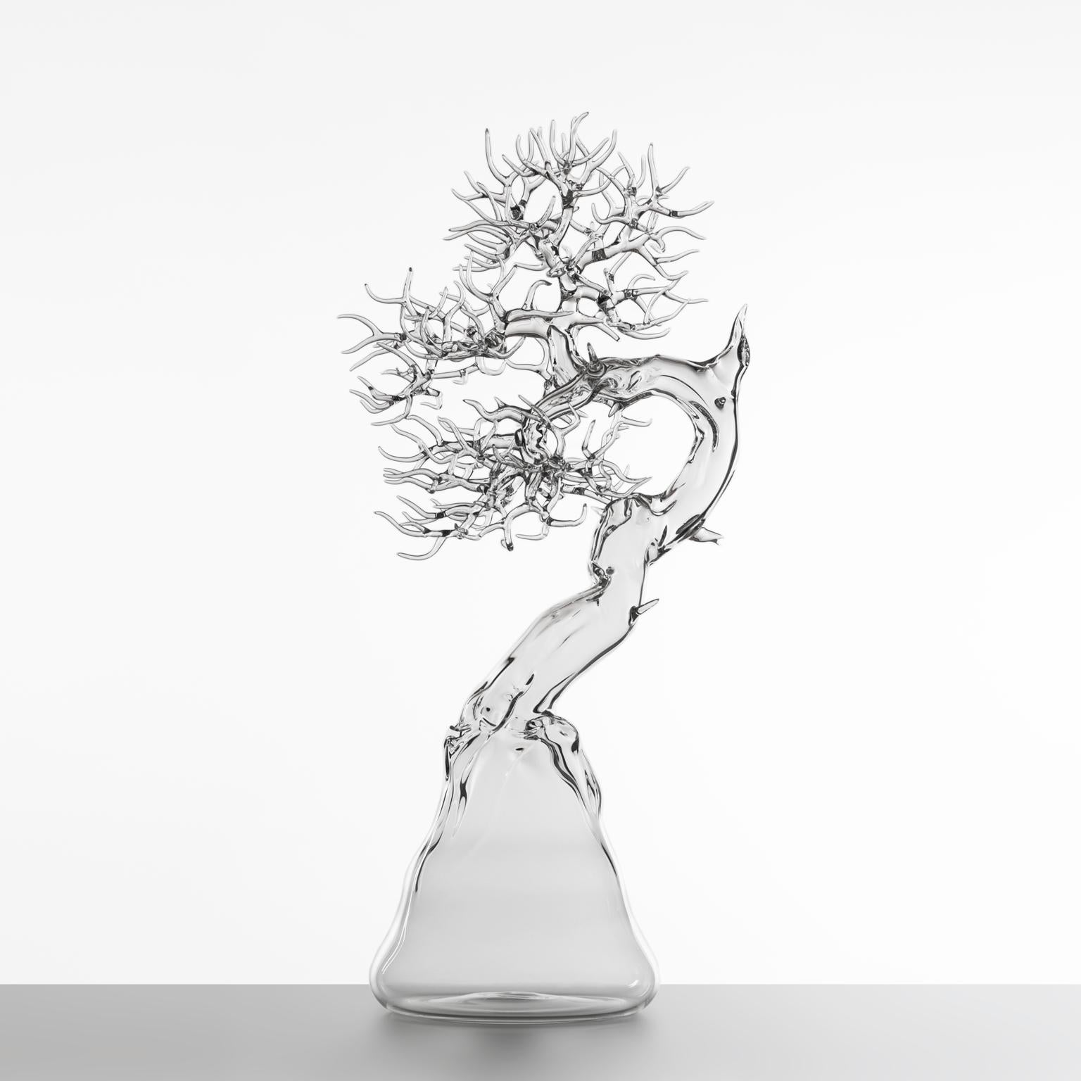Hand-blown glass sculpture representing a bonsai tree.

Artist: Simone Crestani
Material: Borosilicate glass
Technique: Flameworking
Unique piece
Year: 2021
Measures: Height 26.77'', width 11.81'', depth 11.81'' in
Signed and dated on the