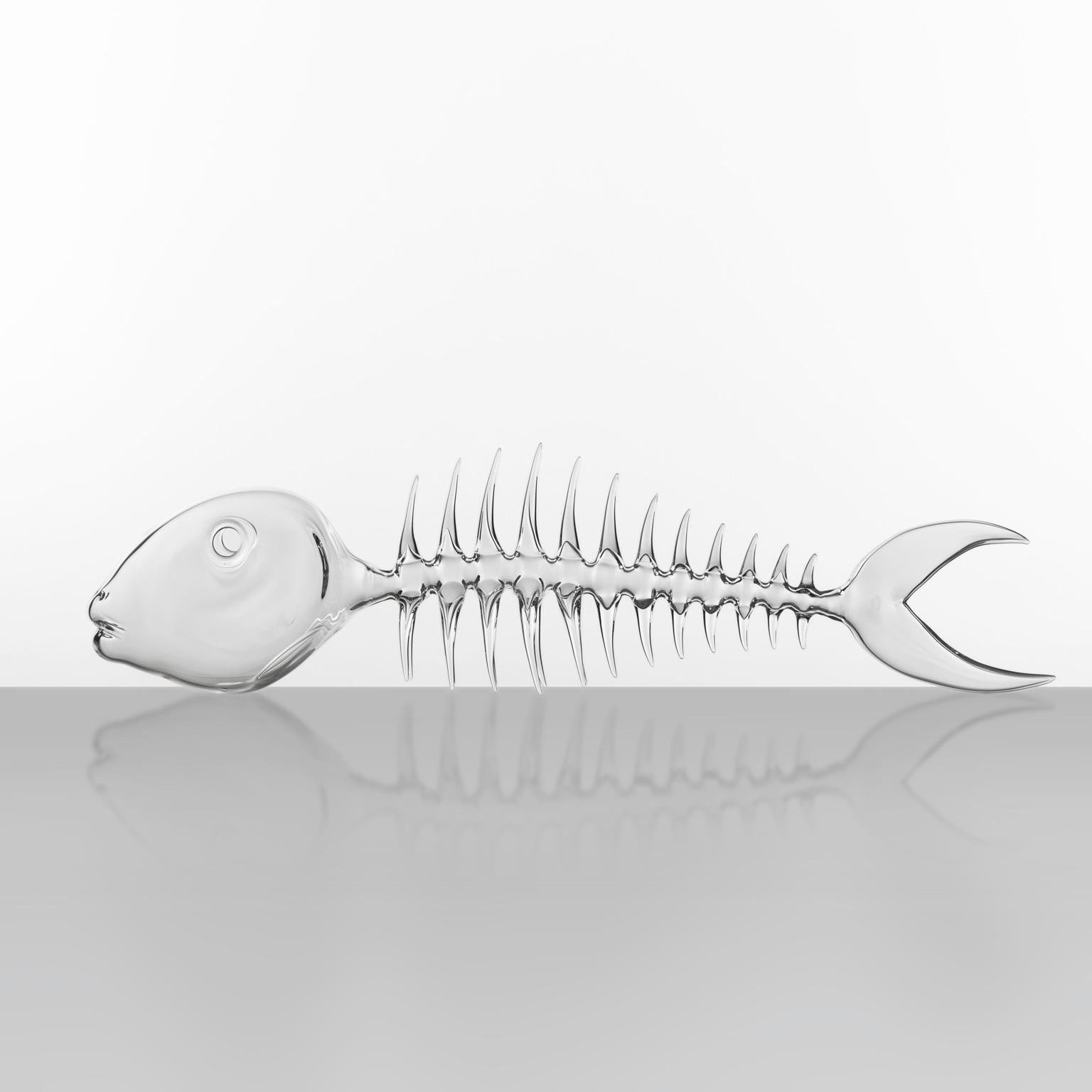 Hand-blown glass sculpture representing the fish's spine/ fishbone.

Artist: Simone Crestani
Material: borosilicate glass
Technique: flameworking
Unique piece
Year: 2021
Measures: height 7.8”, width 26.77