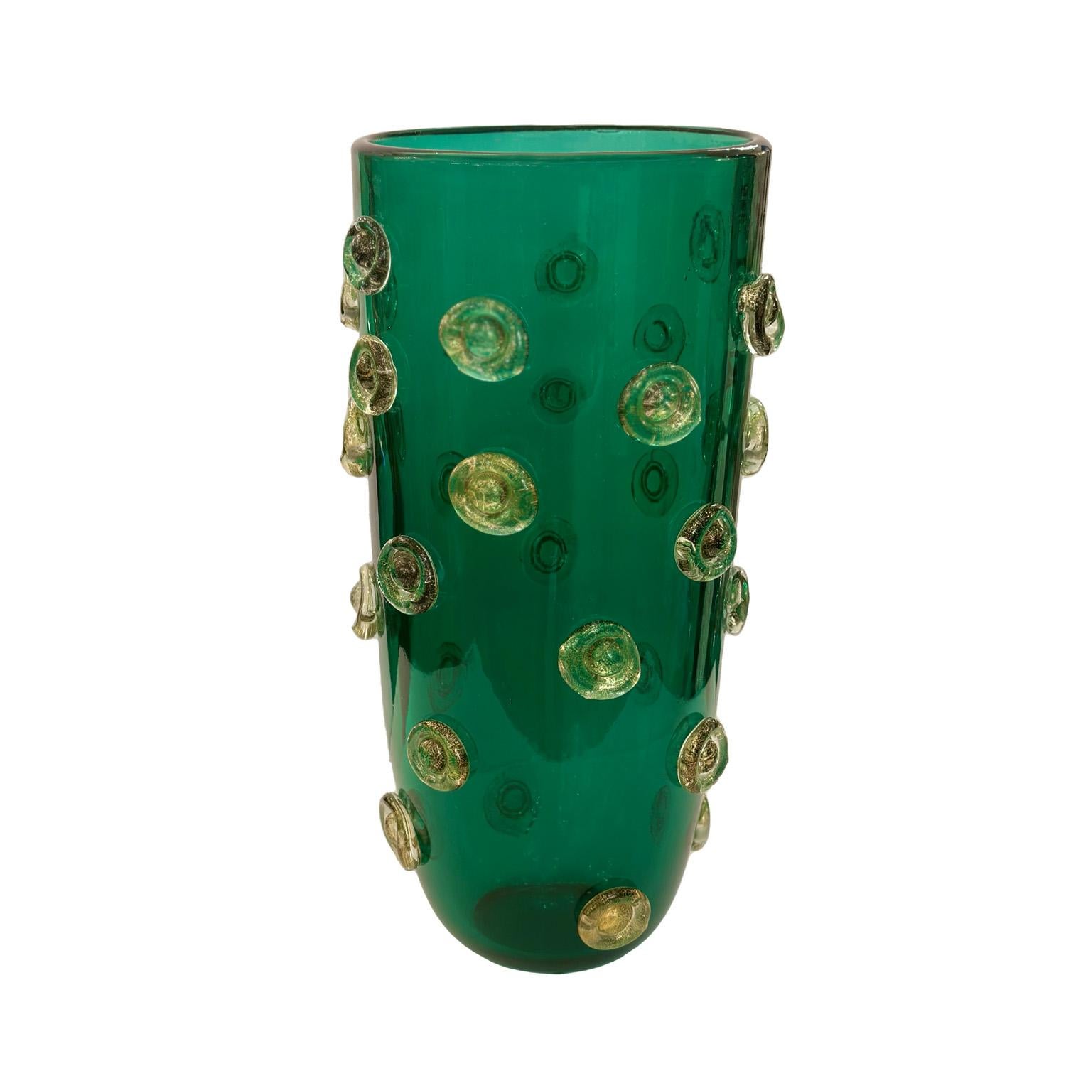 Richly colored Emerald green Murano glass vase decorated with applied dot design in clear glass with gold leaf inclusions. Italy, 2023

This vase is currently available in our NYC showroom. 