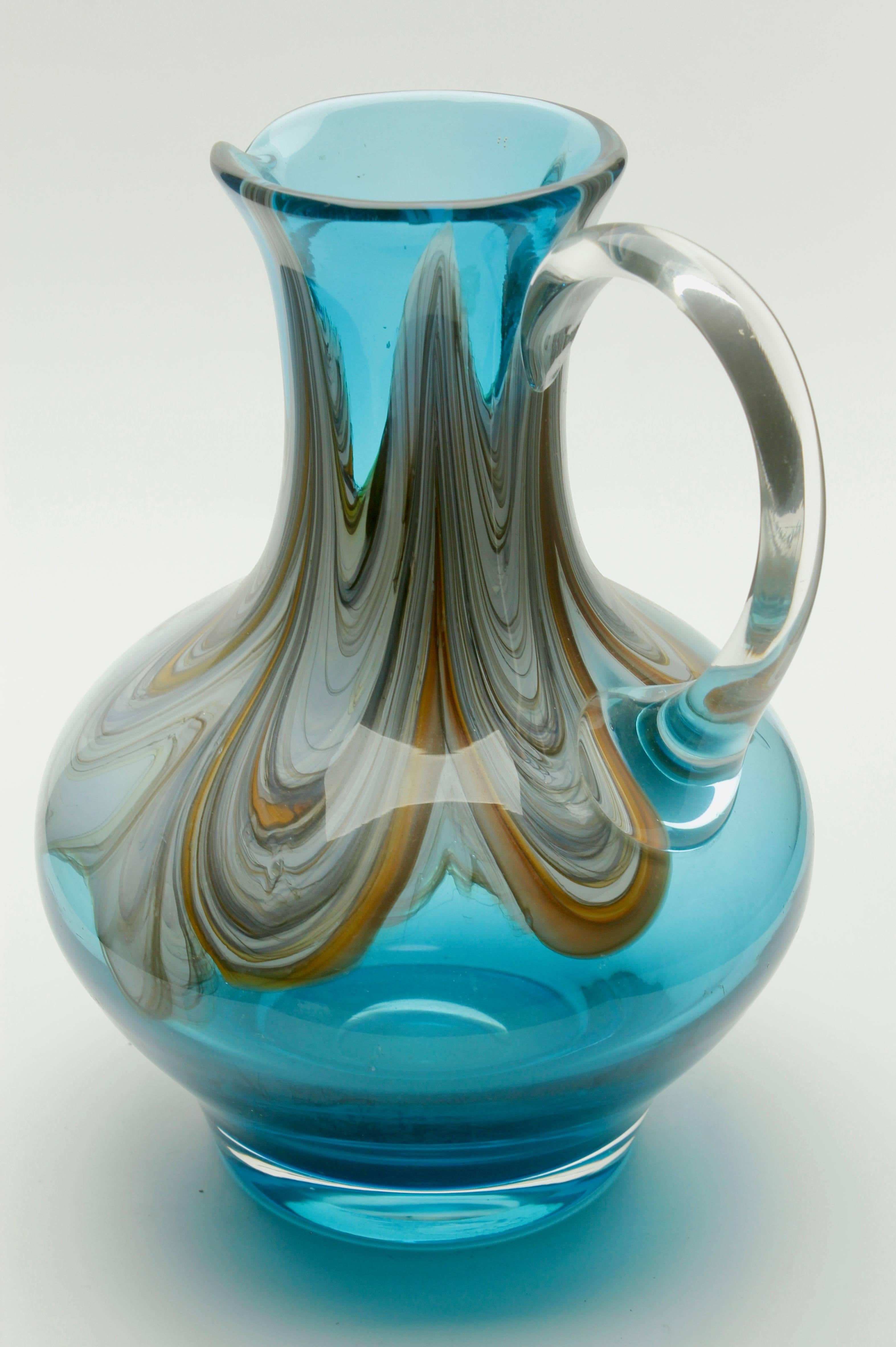 Beautiful hand blown art glass pitcher with agate-colored swirls.
A fantastic mingling of contemporary and classical designs. Excellent condition!

This is a rare color and size, a must-have for any collector.
Looks simply
