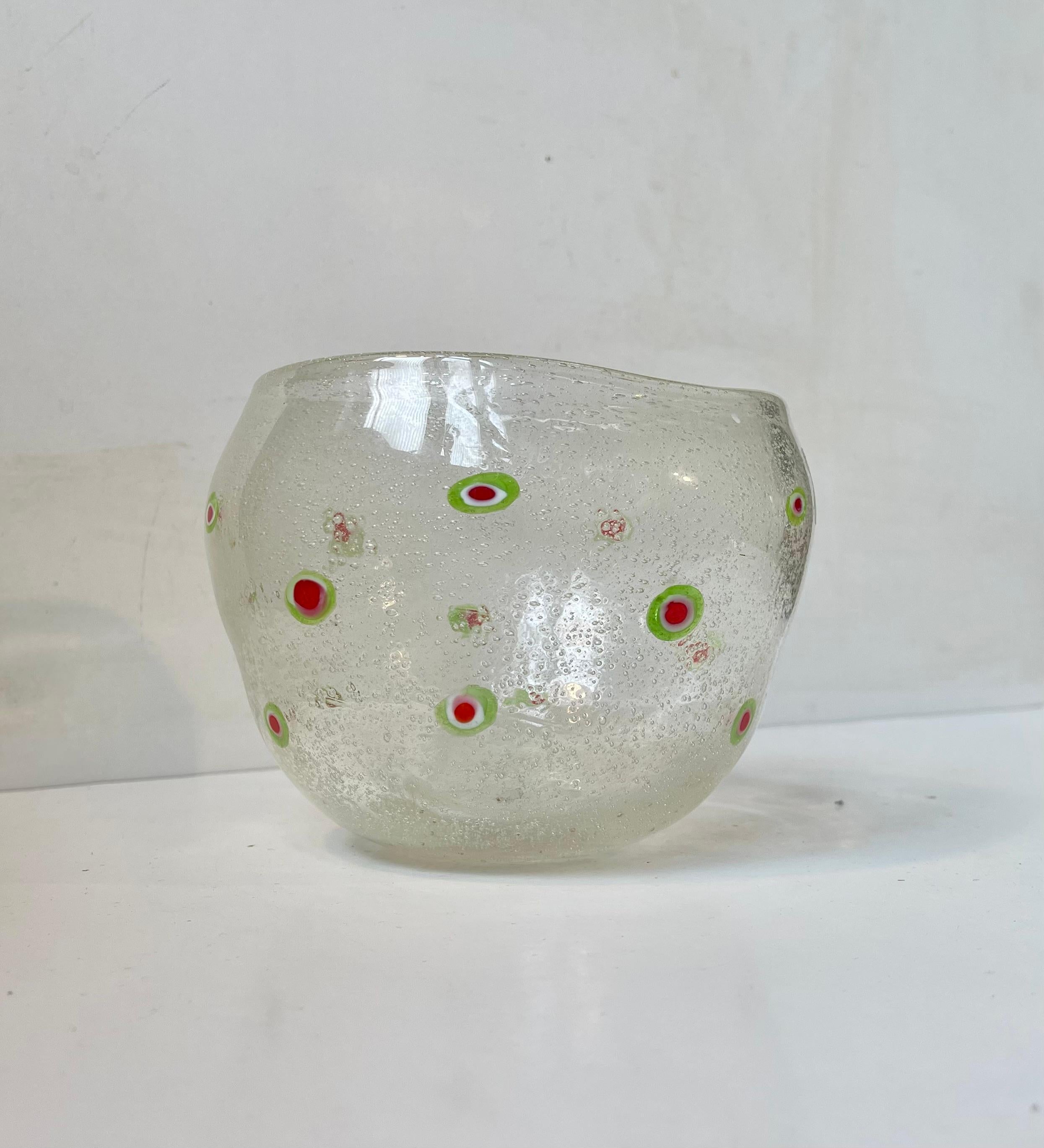Hand blown organically shaped free-form bowl in bubble glass. Decorated with flowers in Italian tri-color: red, green and white. It was made in Murano Italy circa 1960-70. Measurements: H: 12 cm, D: 17/14 cm.