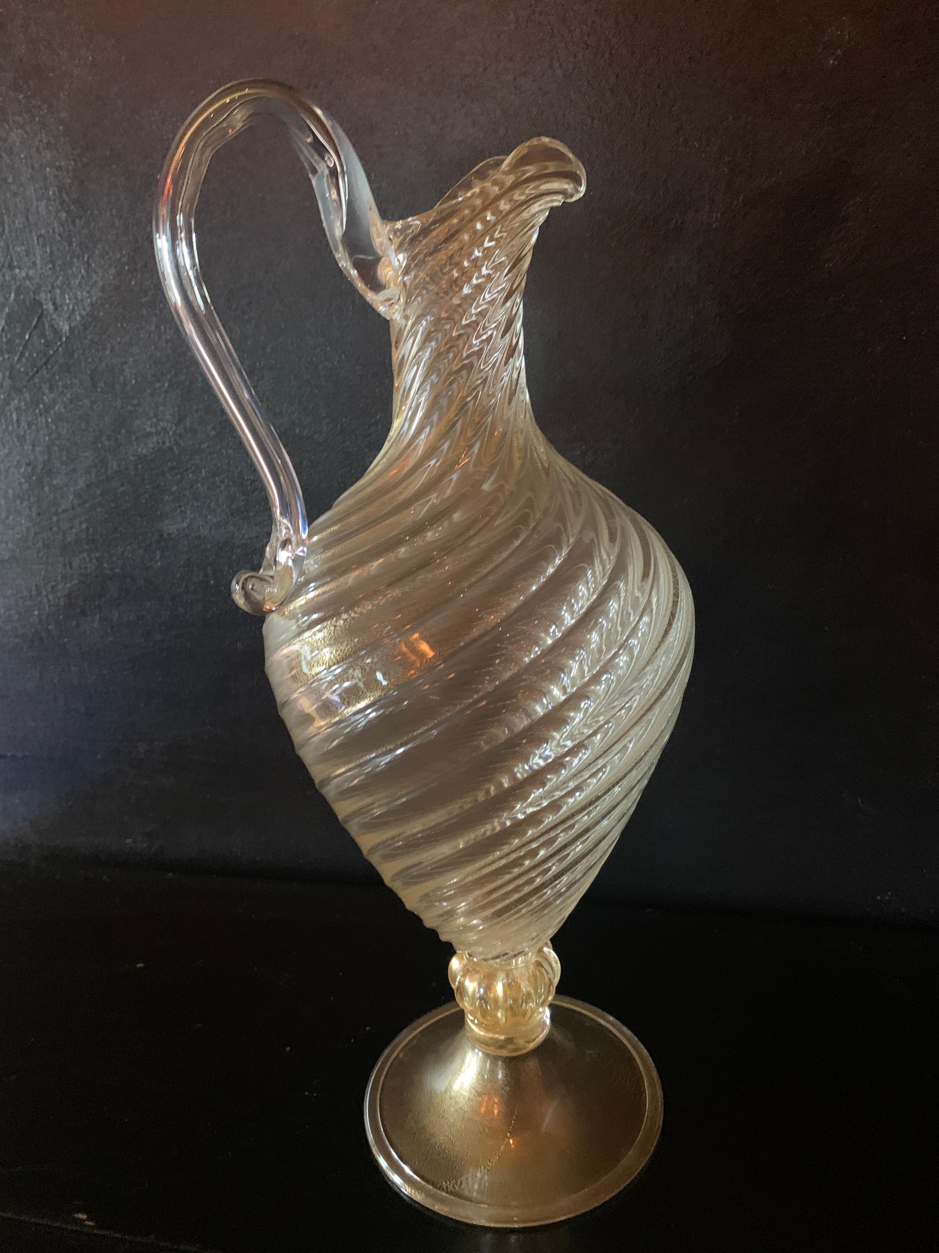 Hand blown Italian Murano swirl decanter with gold leaf inclusions - a compliment to any bar or even the breakfast table. Tall and sophisticated with swirls that catch the light with gold fleck inclusions.
 