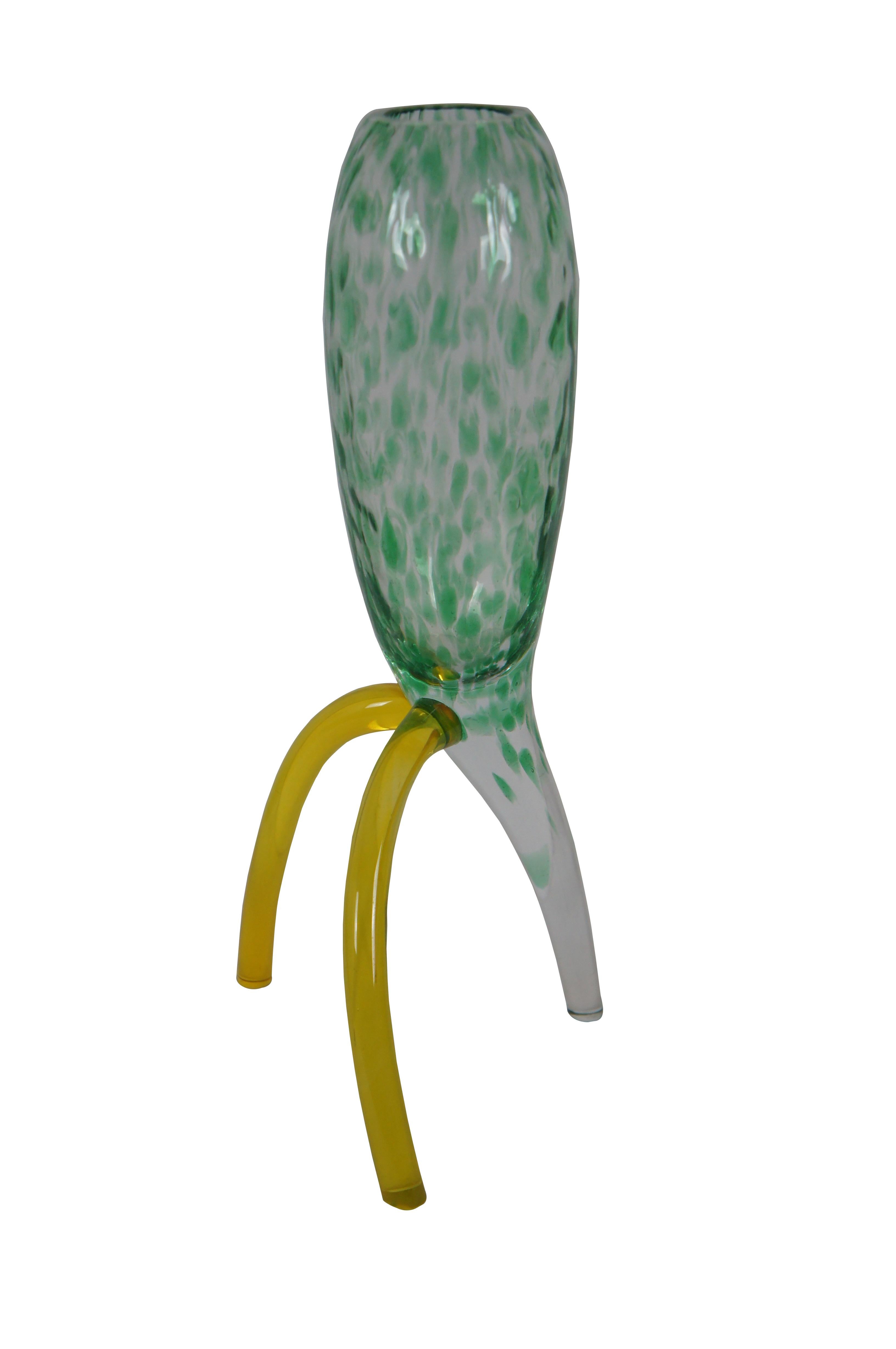Hand blown art glass vase with a uniquely styled shape reminiscent of a mid century rocket ship. Clear glass oblong body and 