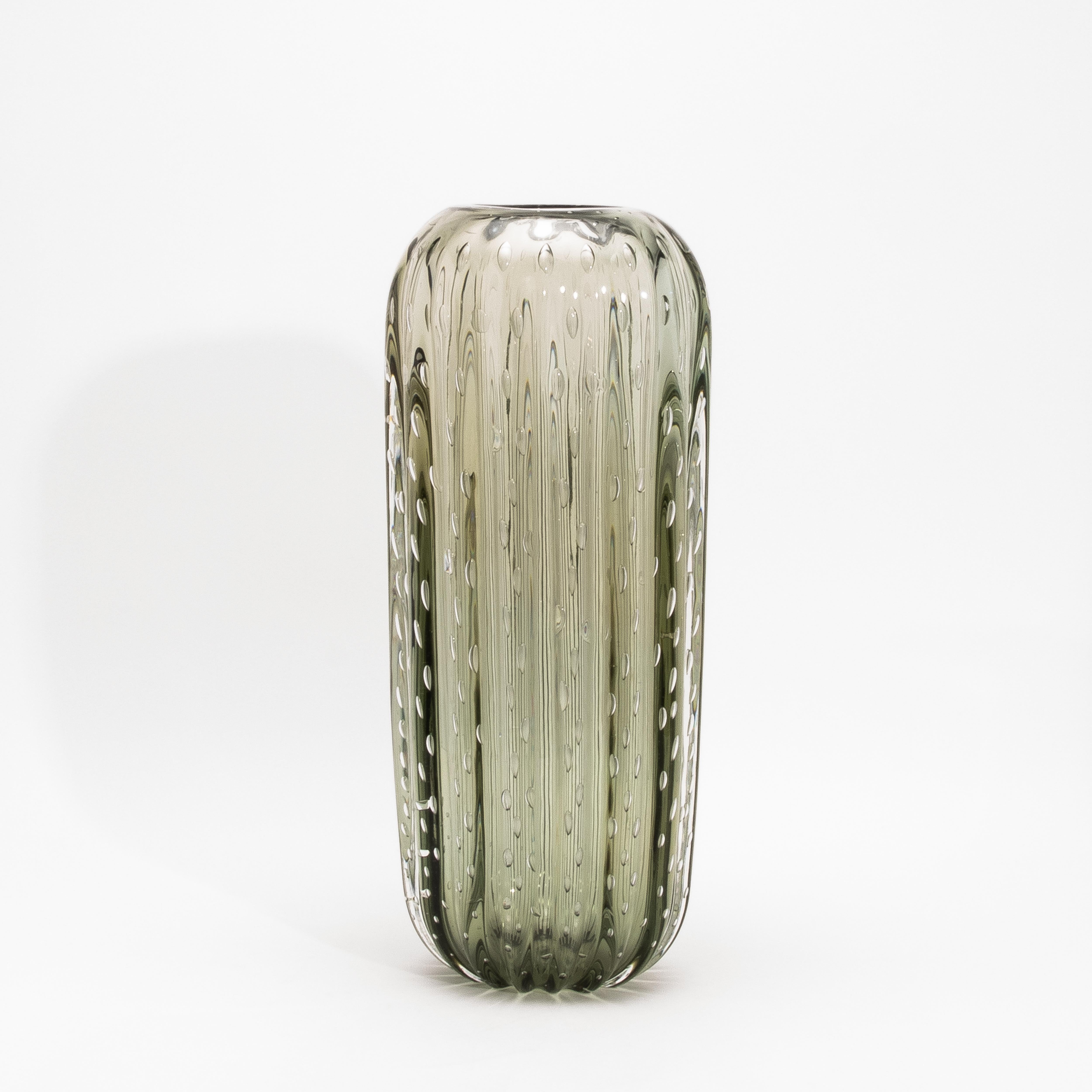 A striking fusion of organic form and Venetian mastery, this Hand-Blown Murano Cactus Vase in Fern Green with Bubbles radiates tactile poetry and sculptural grace. Its gently ribbed body, inspired by the voluptuous curves of desert flora, is