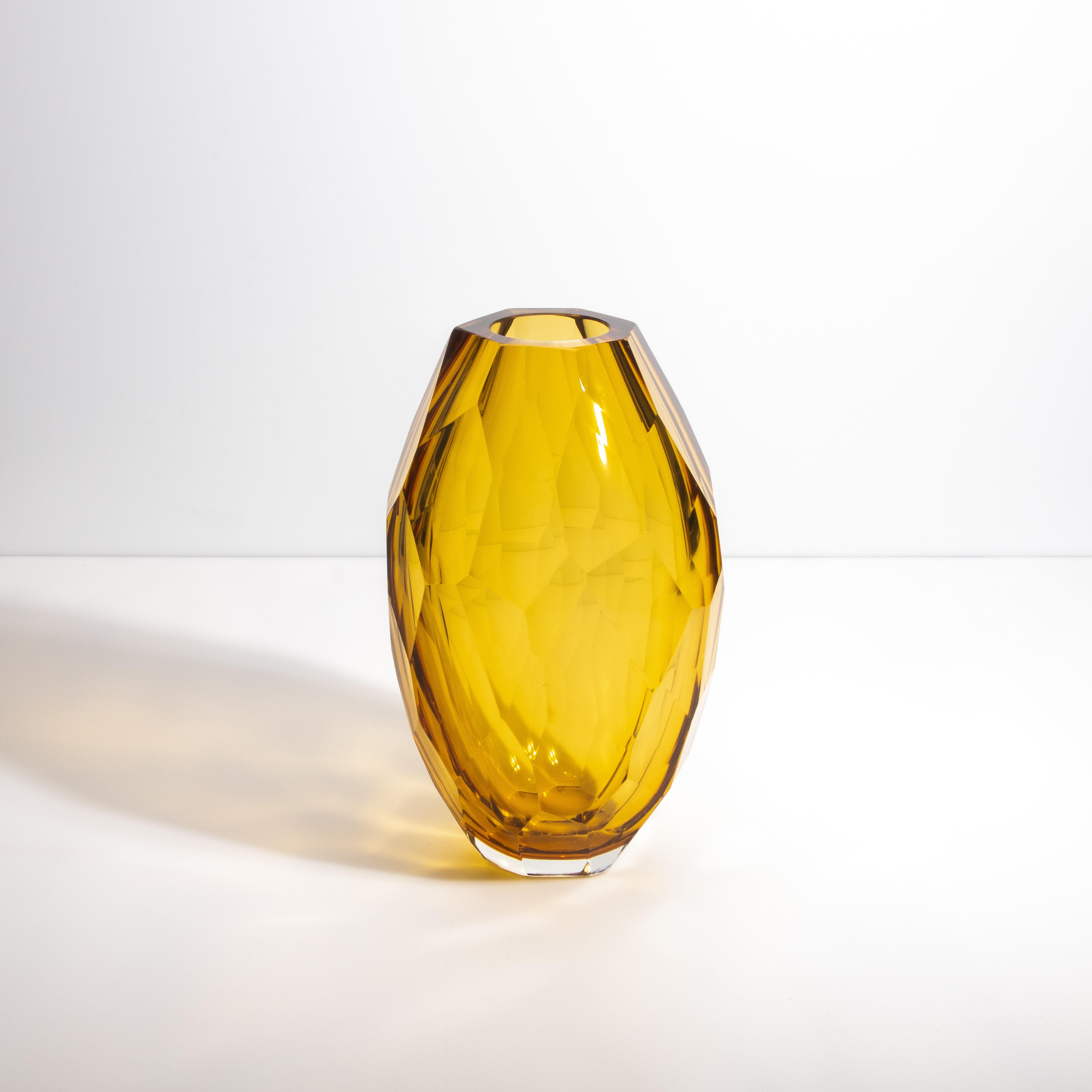 This exquisite amber vase is a testament to the exceptional craftsmanship and artistic heritage of Murano glassmakers. Its rich amber hue is reminiscent of the warm glow of the Venetian sunset, capturing the essence of Italy's natural beauty. The