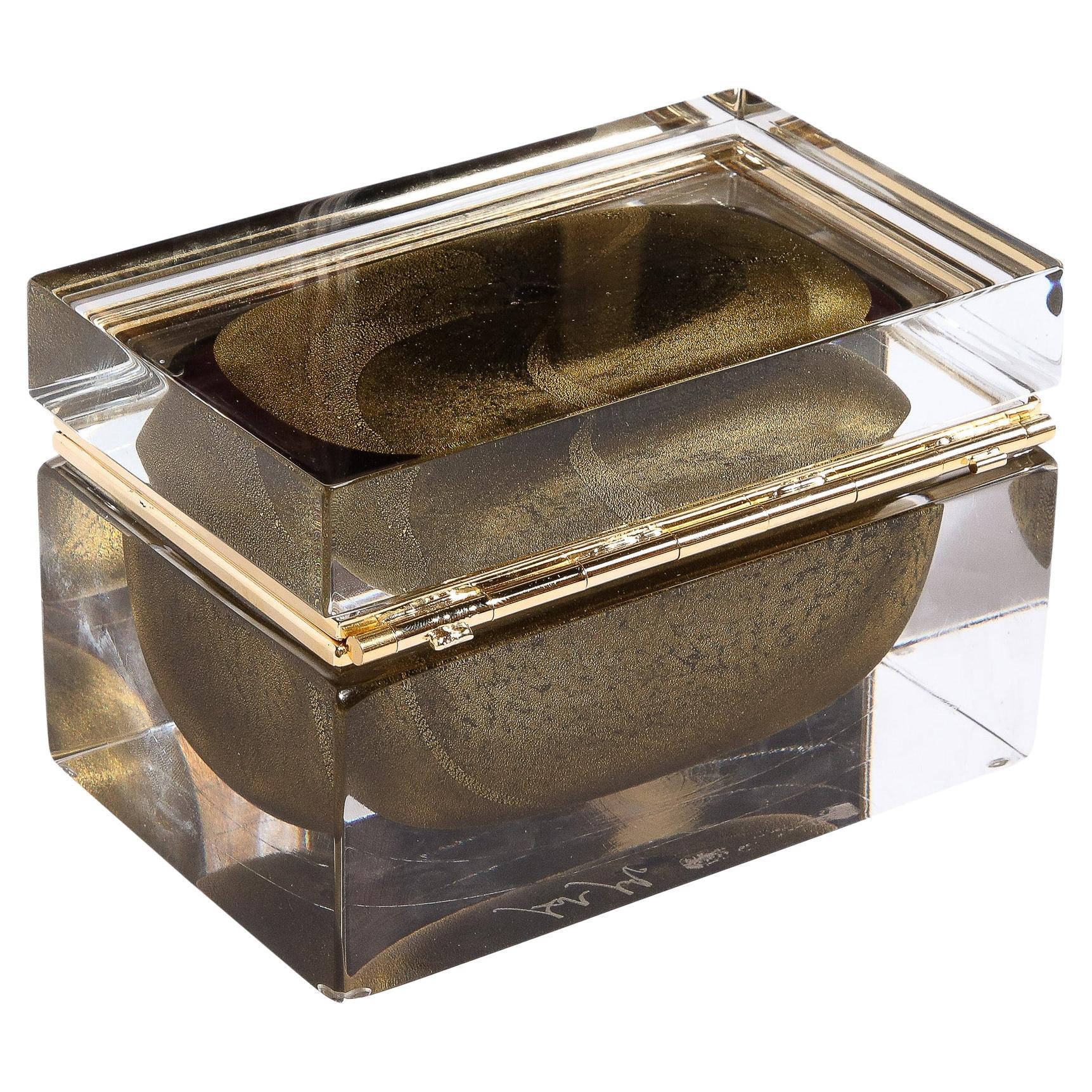 This elegant and impressive modernist decorative box was realized in Murano, Italy- the island off the coast of Venice renowned for centuries for its superlative glass production. It features a volumetric rectangular body with a translucent Murano