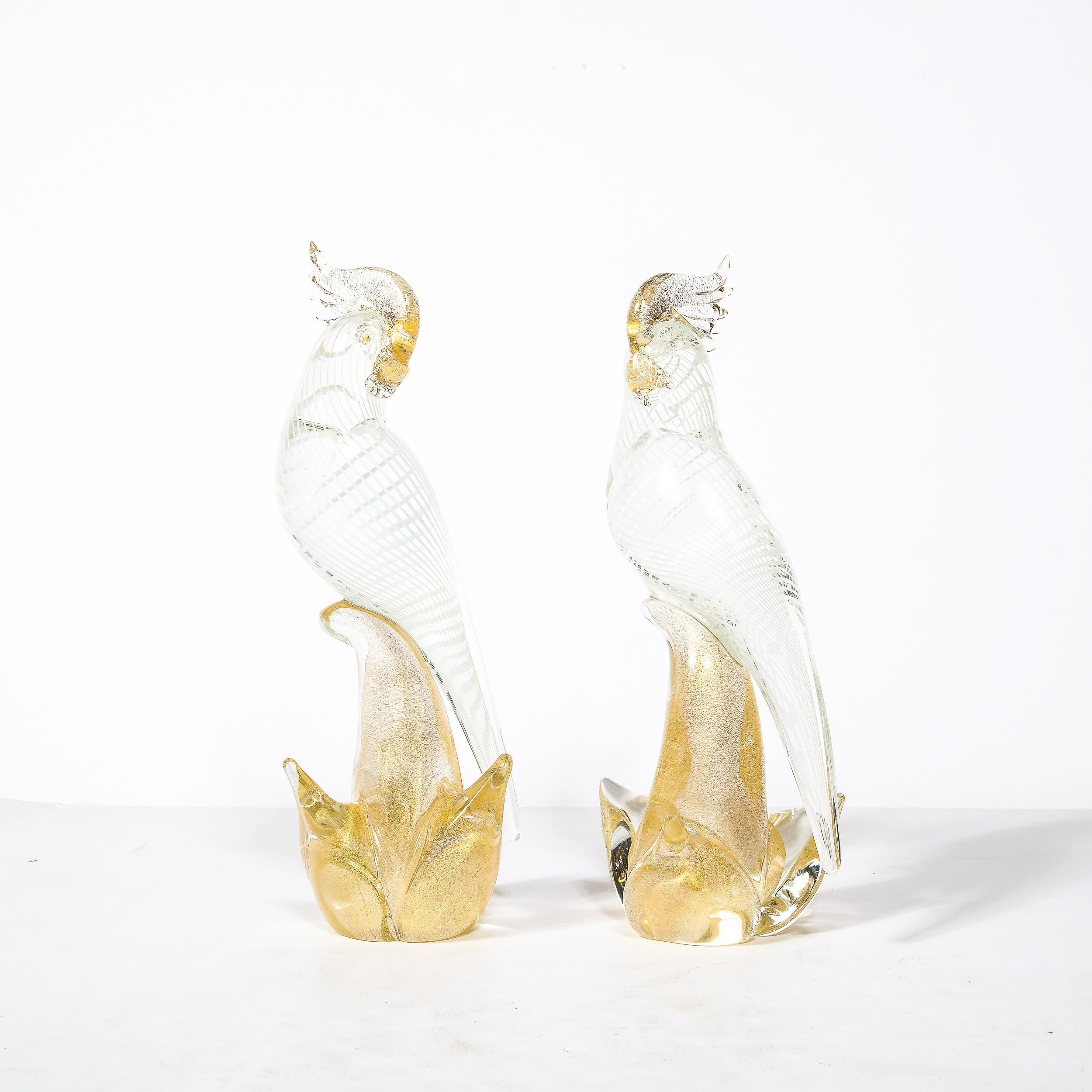 This pair of Hand Blown Murano Glass Sculptures Originates from Italy, Circa 1950. Hand-Blown in Translucent Murano Glass with White Filigree Detailing and 24 Karat Gold Flecks, the pair are sculptures of Cockatiels Perched in a relaxed pose with