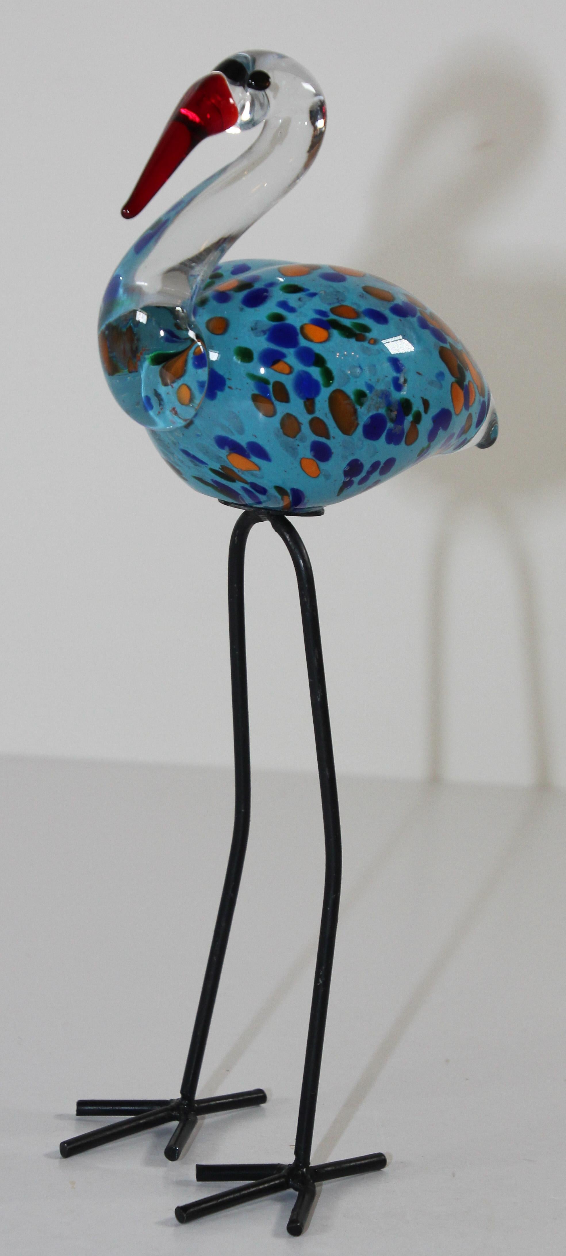 Vintage Murano art glass hand blown sculpture bird Flamingo figurine with long metal legs.
Beautiful Mid-Century Modern hand blown glass bird.
The body of bubbles Italian art glass decorated in clear, blue, orange and white bubbles with long metal