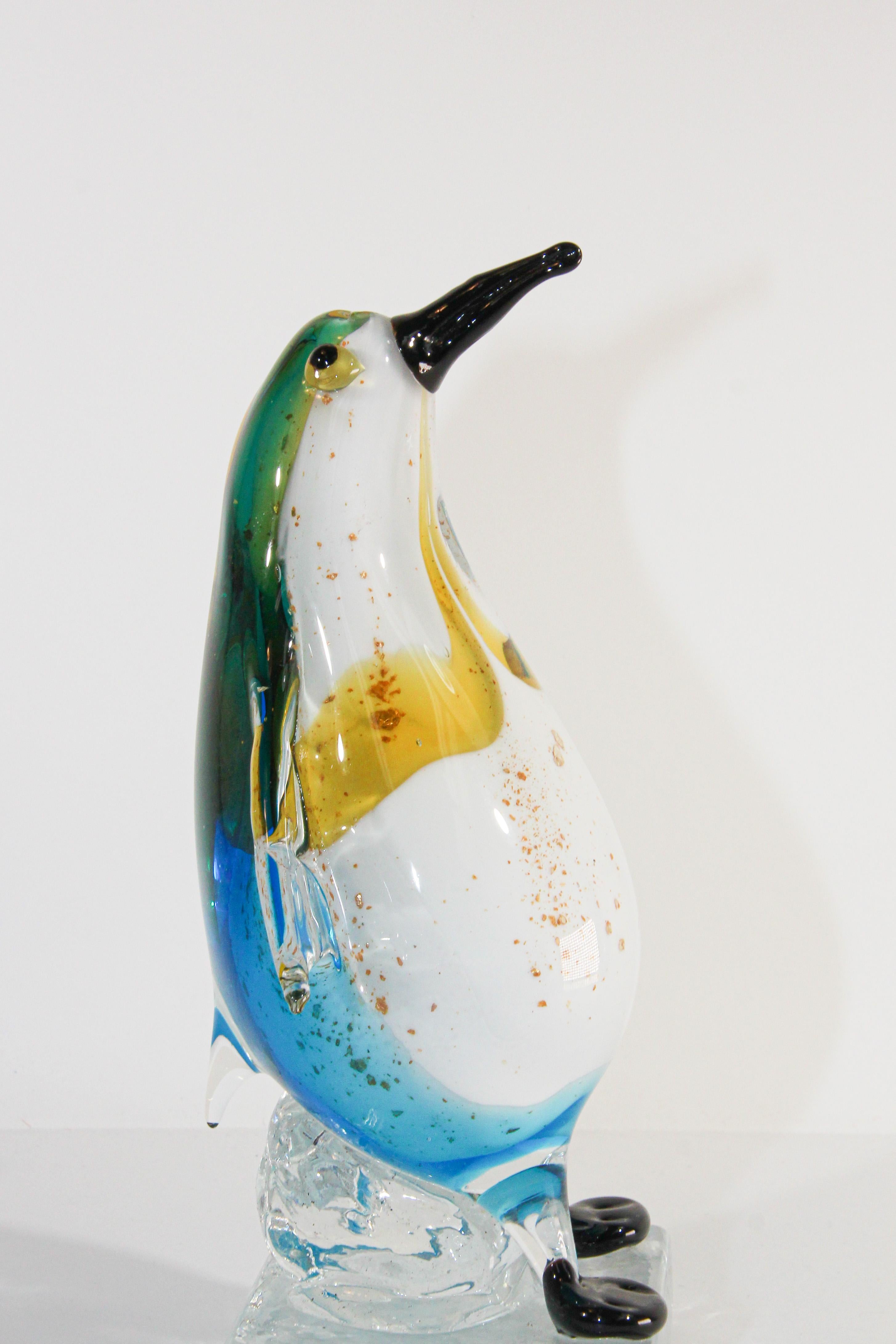 Vintage collectible Murano art glass hand blown sculpture of a penguin in blue and yellow colored glass figurine with gold murine.
Handcrafted beautiful Mid-Century Modern hand blown art glass Italian decorated in clear, blue, black and