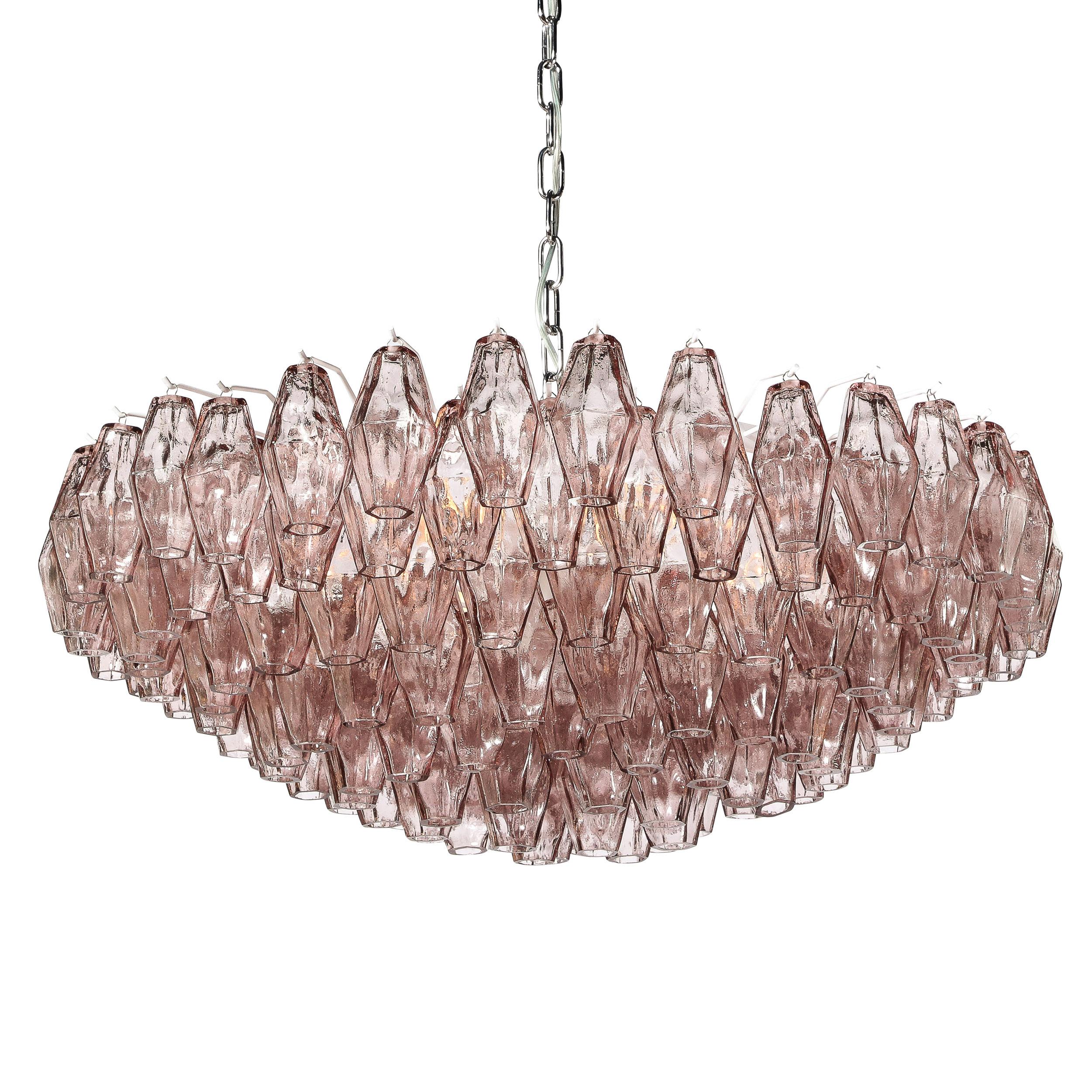 This beautiful Murano glass chandelier, in the manner of Venini, was hand blown in Murano, Italy- the island off the coast of Venice renowned for centuries for its superlative glass production. It features a constellation of handblown Murano glass