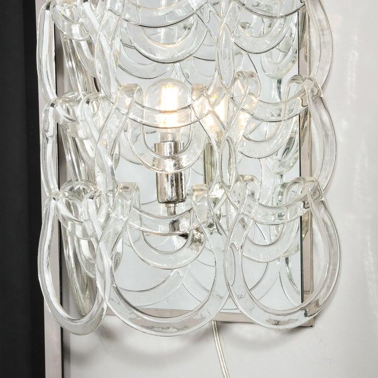 This refined Mid-Century Modern sconce was realized by the legendary designer Angelo Mangiarotti for Vistosi in Murano, Italy circa 1970. Created in the fabled factory of Vistosi in Murano, Italy- the island off the Coast of Venice renowned for