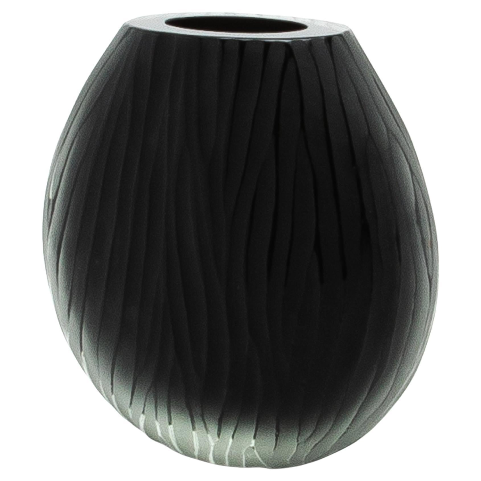 The Hand-Blown Murano Supreme Vase in black is a stunning embodiment of Italian artistry and sophistication, designed to elevate any interior with its timeless allure. This exquisite piece showcases a harmonious blend of frosted and clear glass,