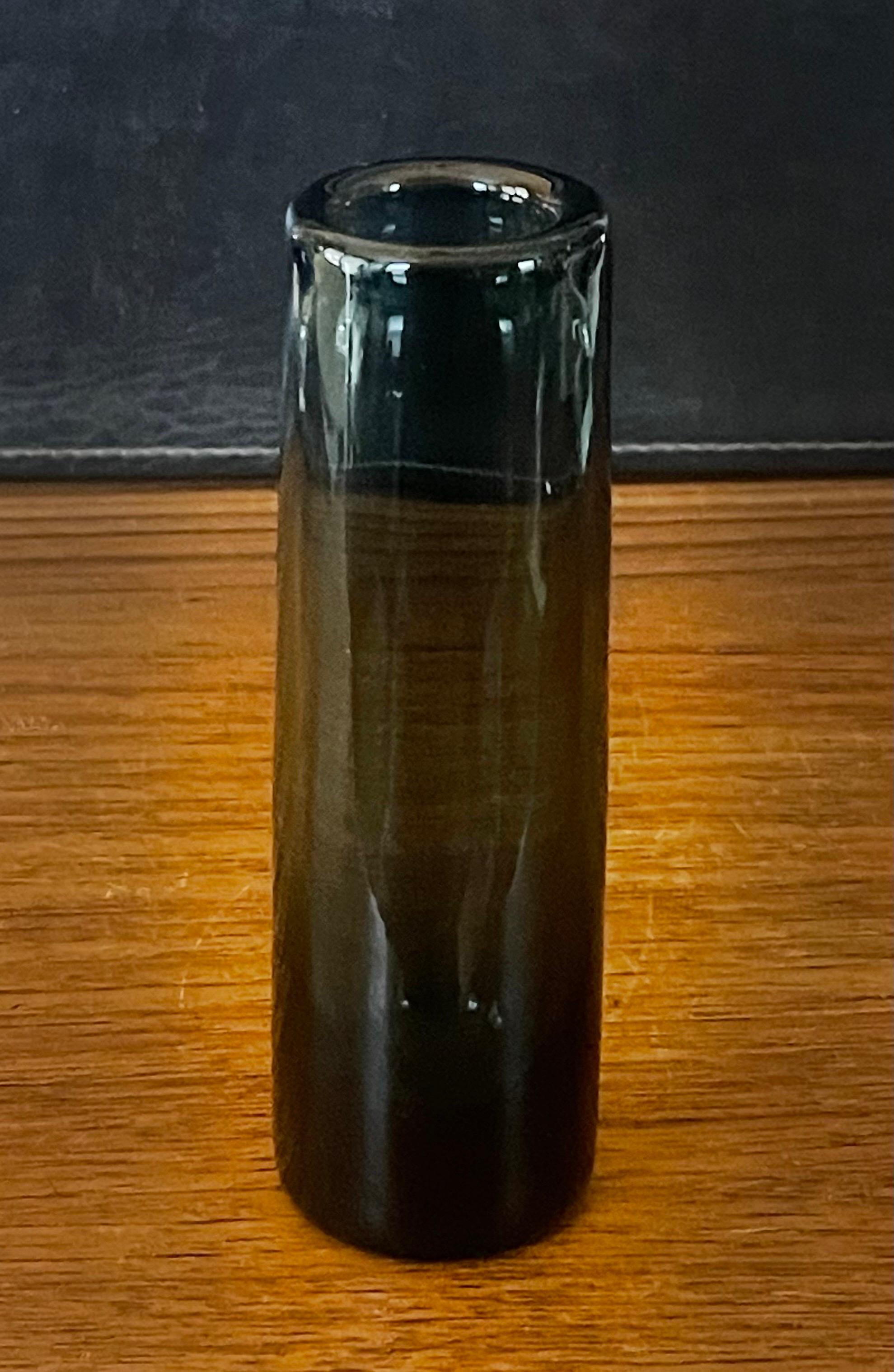 A very attractive hand blown smoked glass cylindrical vase by Per Lutken for Holmegaard, circa 1960s. The piece is in very good vintage condition with no chips or cracks and measures 2