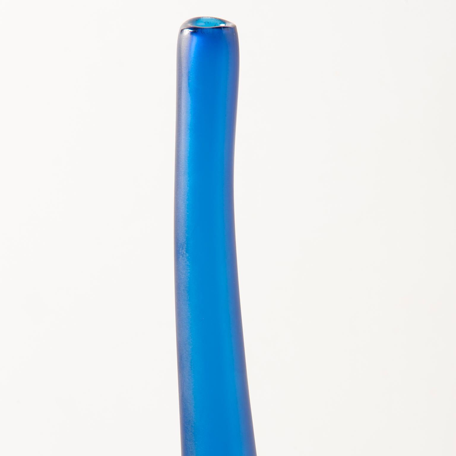 Designed and signed by artist Laura de Santillana for arcade Murano glass, handblown vase is #272 from a limited edition of 300. Just under two feet tall, this narrow vase is Aegean blue. New, limited edition with no flaws found.
 