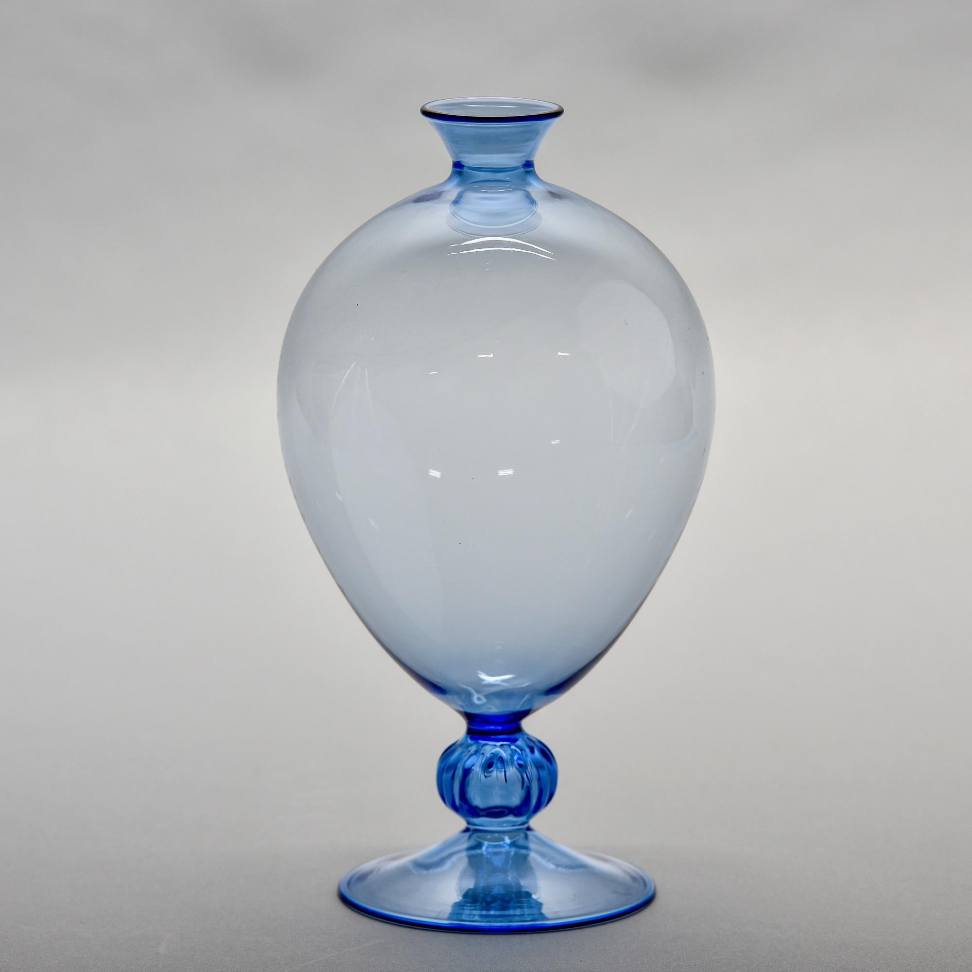 New Murano glass mouth blown pedestal vase in blue. Very thin-walled blown glass with round body and thin neck and mouth. Unsigned. 

New with no flaws found.