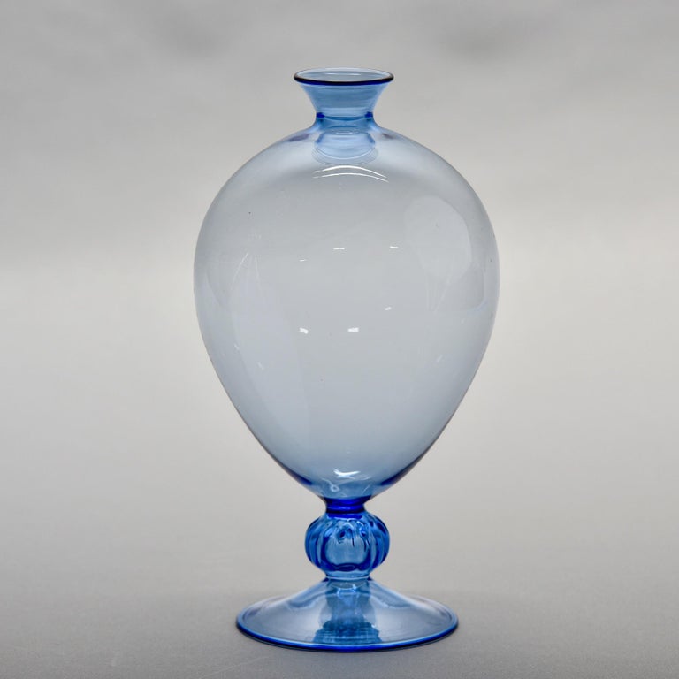 New Murano glass mouth blown pedestal vase in blue. Very thin-walled blown glass with round body and thin neck and mouth. Unsigned. 

New with no flaws found.