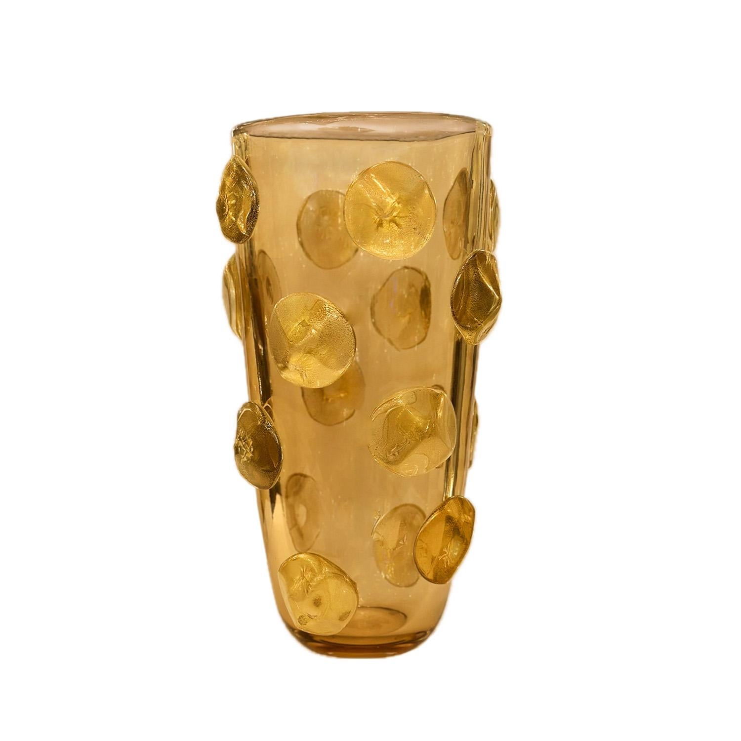 Tone on tone Topaz Murano glass vase decorated with applied dot design in Topaz glass with gold leaf inclusions.  Italy 2023.

This vase is currently available in our NYC showroom. It is also available in Blue and Emerald Green glass with gold leaf