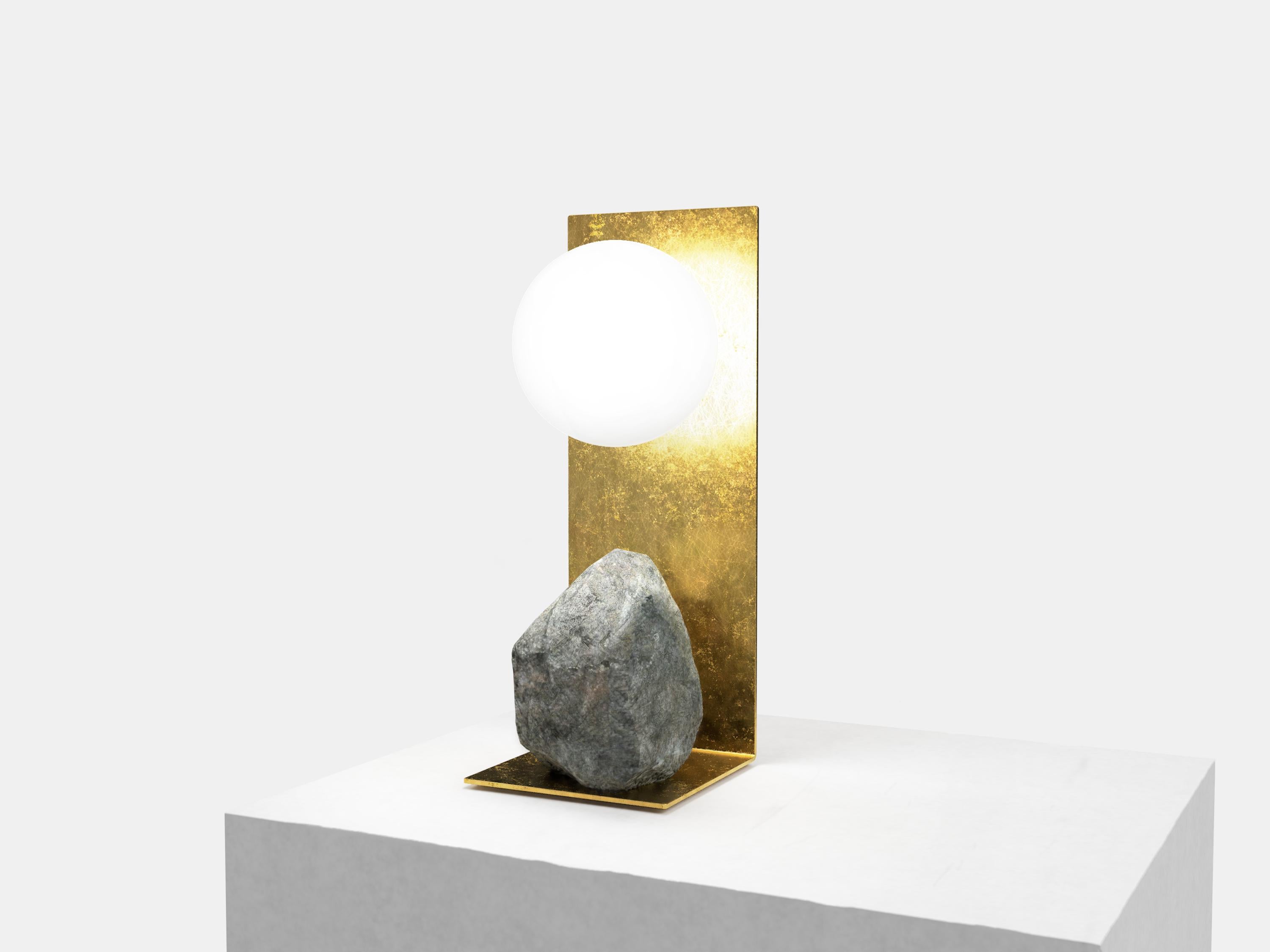 Hand brushed brass and stone table lamp by Batten and Kamp
Shelter to Ground collection
Signed
Limited edition of 25 + 2 AP
Dimensions: W 14 x D 14 x H 33 cm
Materials: Hand brushed brass, natural stone, tinted glass.
LED, electrical components
Each
