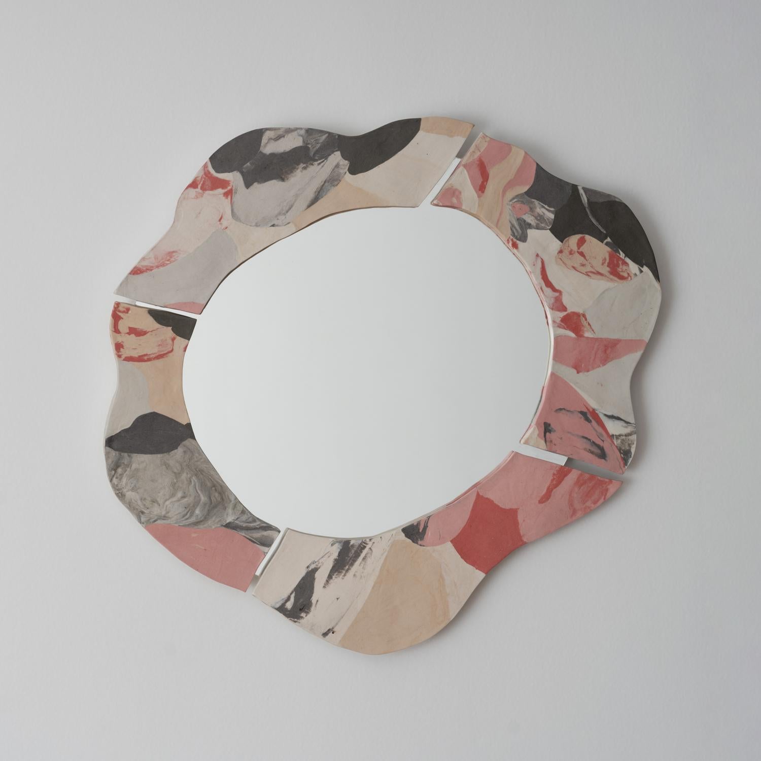 Hand-built Nerikomi Porcelain mirror in a delicate palette of pale pink, warm peach, charcoal grey, and dove white. A beautiful piece for anywhere in the house, including the living room, a powder room, or even a child's bedroom.

Additional