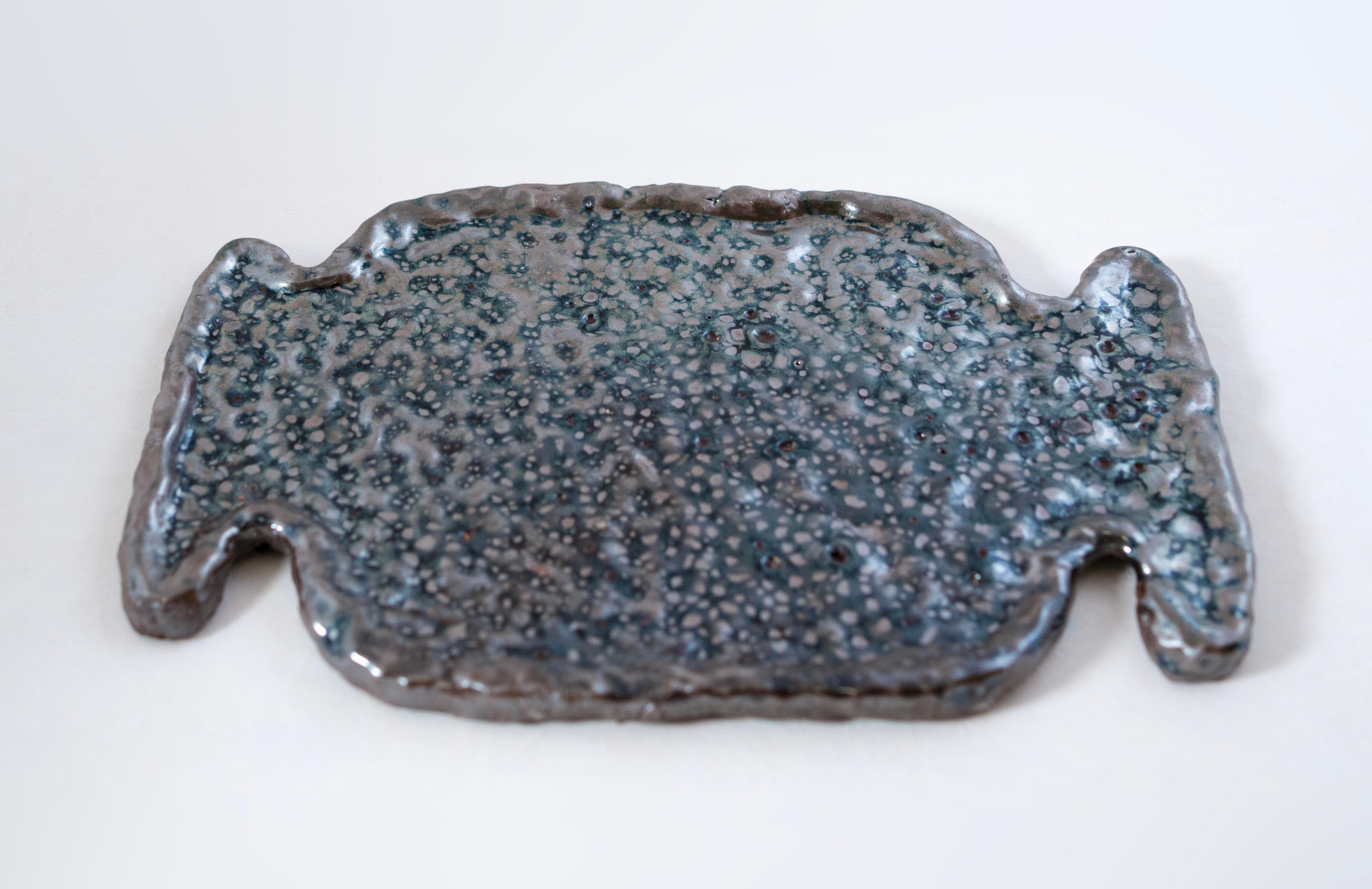 Plate made with local clay from Shigaraki, one of the six ancient kiln sites in Japan. Shigaraki is known for the special qualities of their clay. This sandy clay comes from the bed of Lake Biwa which is over 4 million years old. These rustic