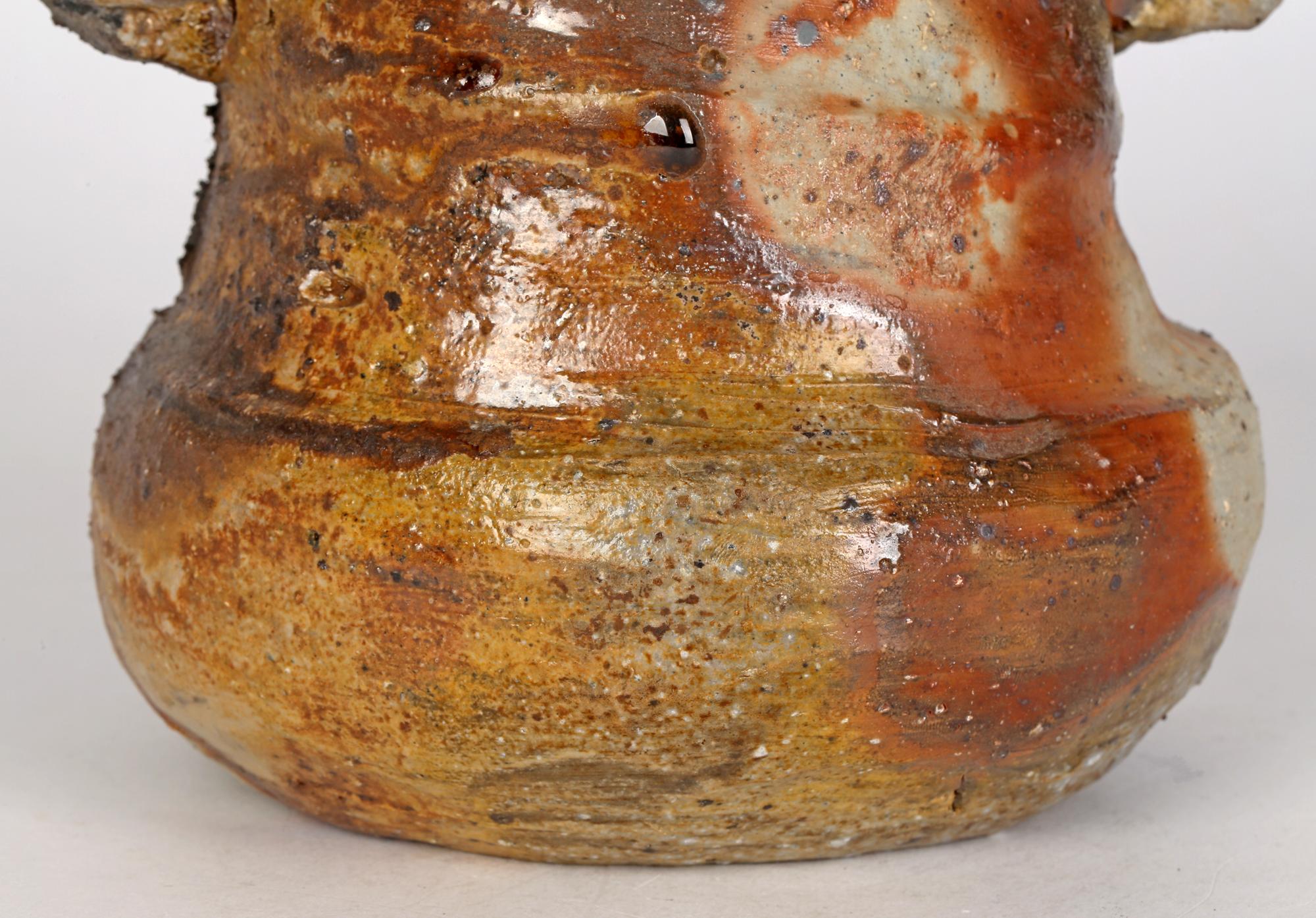 A truly wonderful design piece, and one of my favourite pieces, is this hand-built wood fired twin handled studio pottery vase of sculptural form dating from the 20th century. The stoneware vase is heavily potted with what appears to be layers of