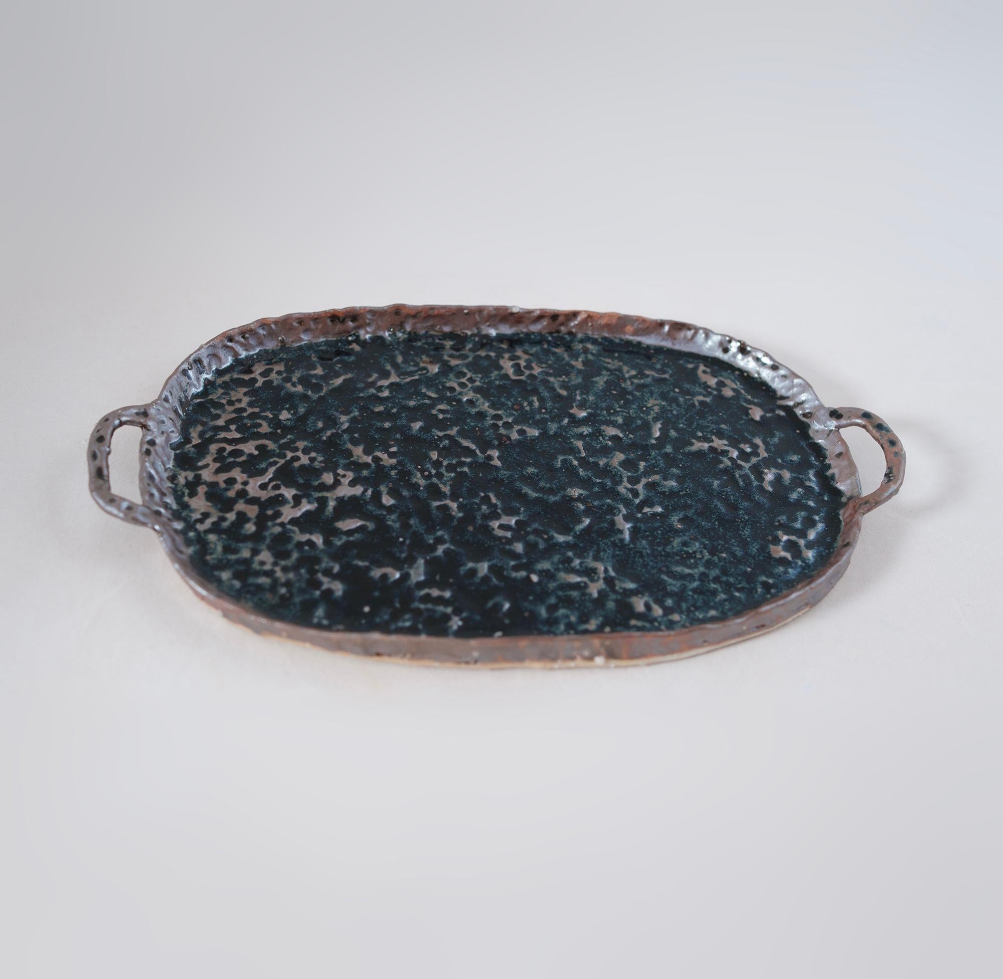 Serving tray made with local clay from Shigaraki, one of the six ancient kiln sites in Japan. Shigaraki is known for the special qualities of their clay. This sandy clay comes from the bed of Lake Biwa which is over 4 million years old. The clay has