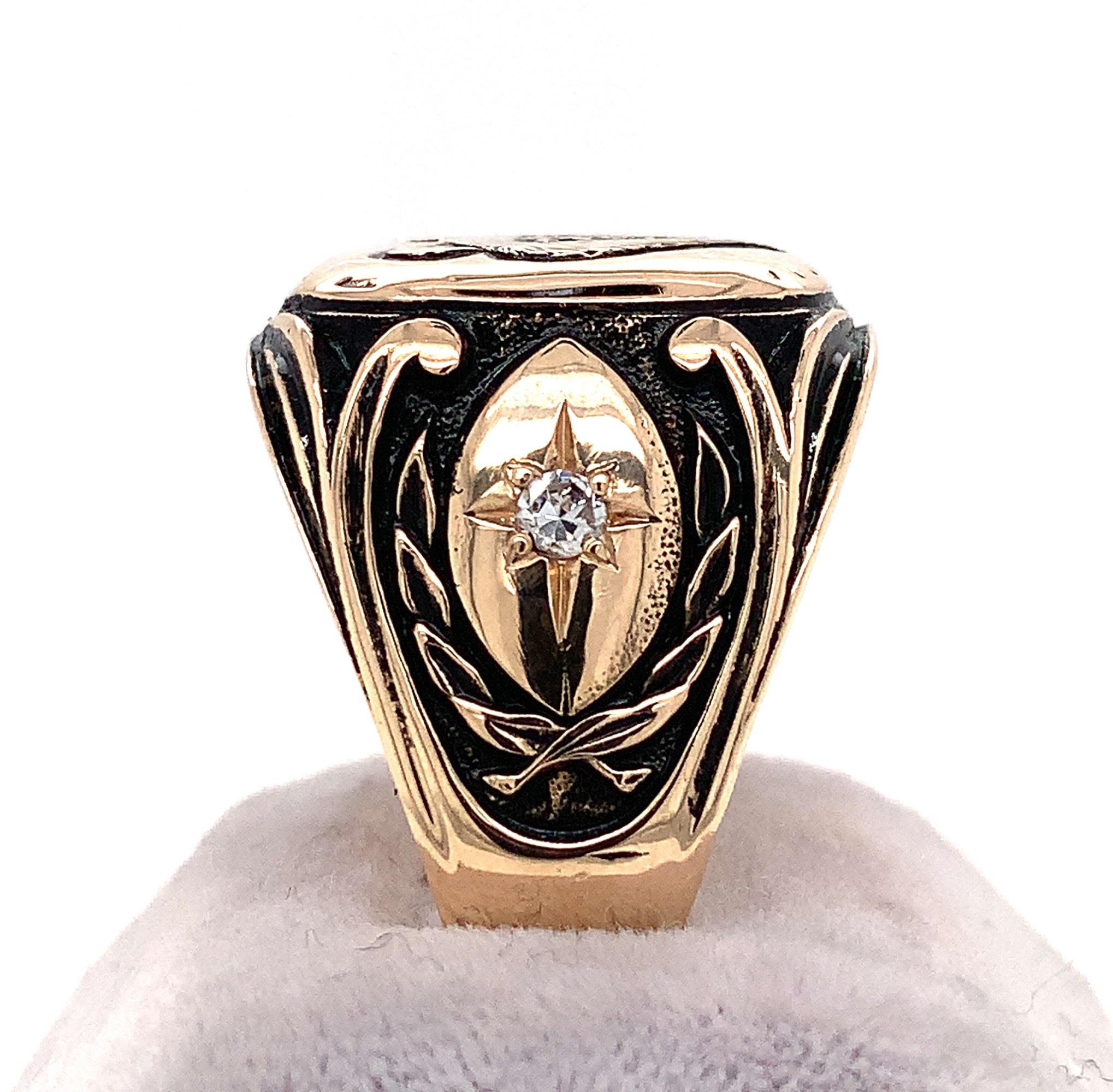 Incredible 14K yellow gold men's ring with a hand carved and chased bear. This is a very heavy cast ring weighing 16.62dwt or 25.84 grams. There are 2 round diamonds measuring about 2.5mm and weighing .12cts total. The ring fits a size 13 3/4 finger