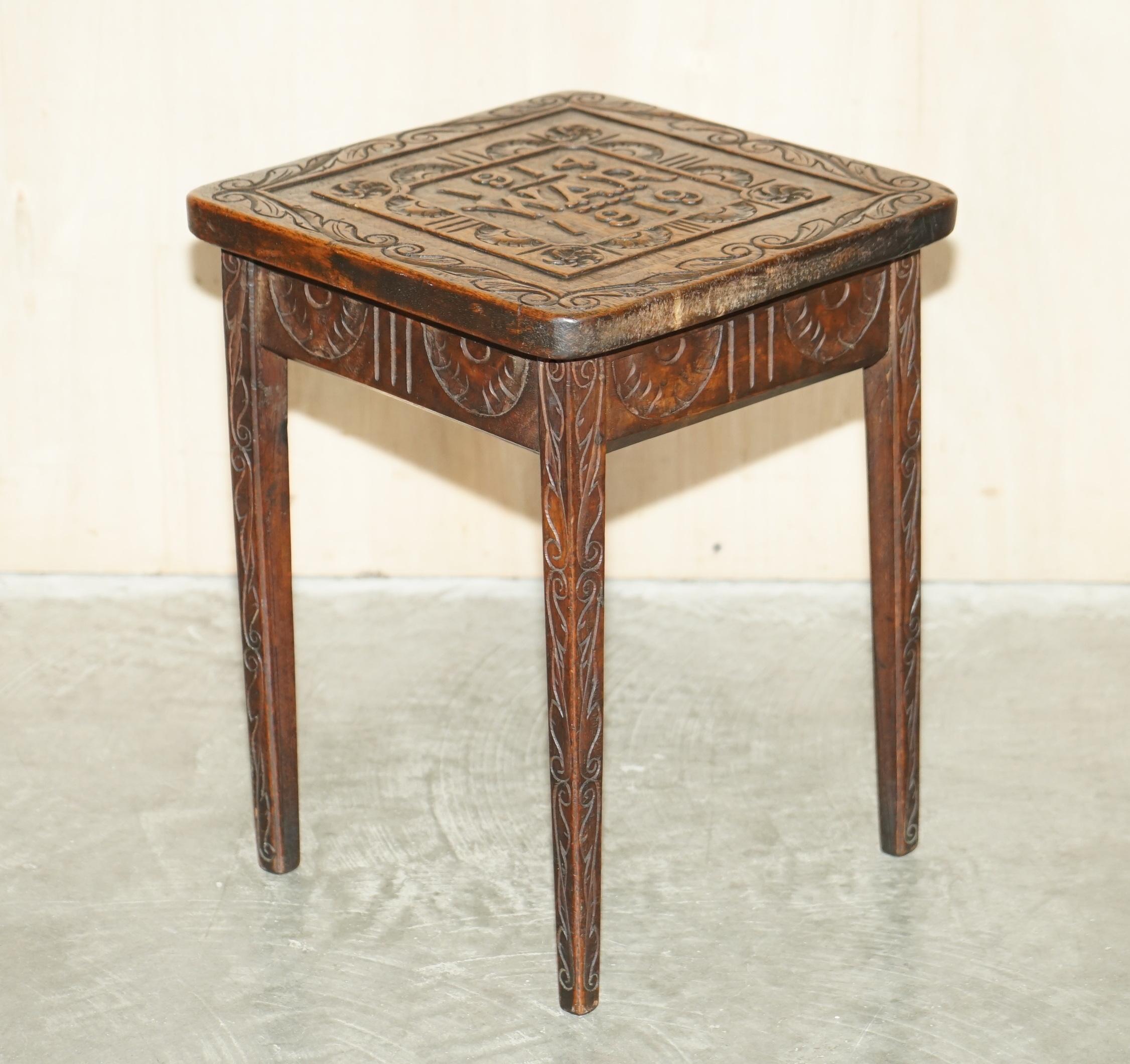 We are delighted to offer for sale this lovely one of a kind WWI commemorative hand carved side table.

A good-looking piece, its hand carved from top to bottom with Jacobean floral detailing, the top as you can see commemorates the first world