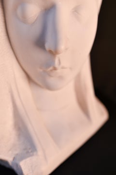 Hand-carved 20th century female bust in white Carrara marble, by P. Simoens