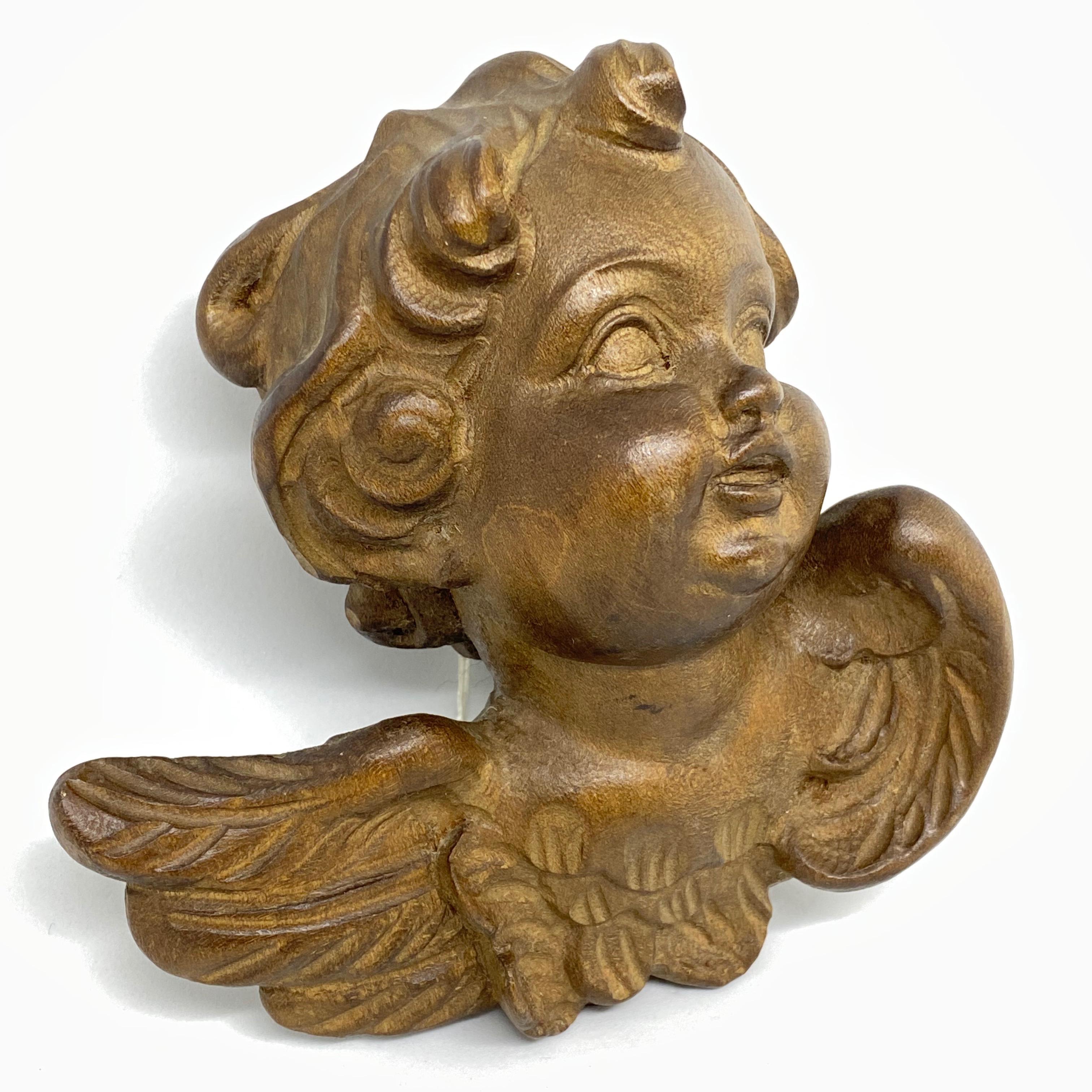 wooden angel heads