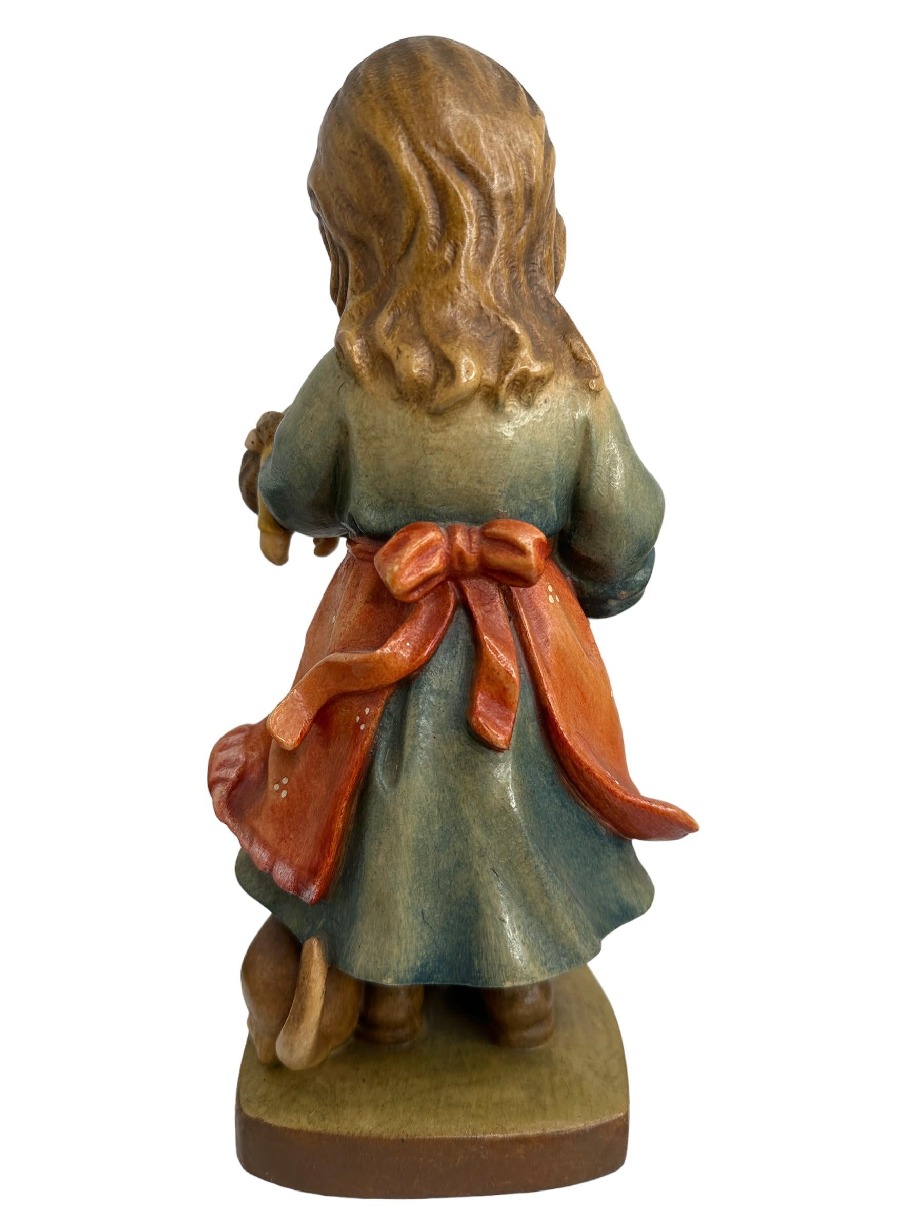 Folk Art Hand Carved 20th Century Wooden Girl with Doll and Cat Figure by ANRI, Italy For Sale