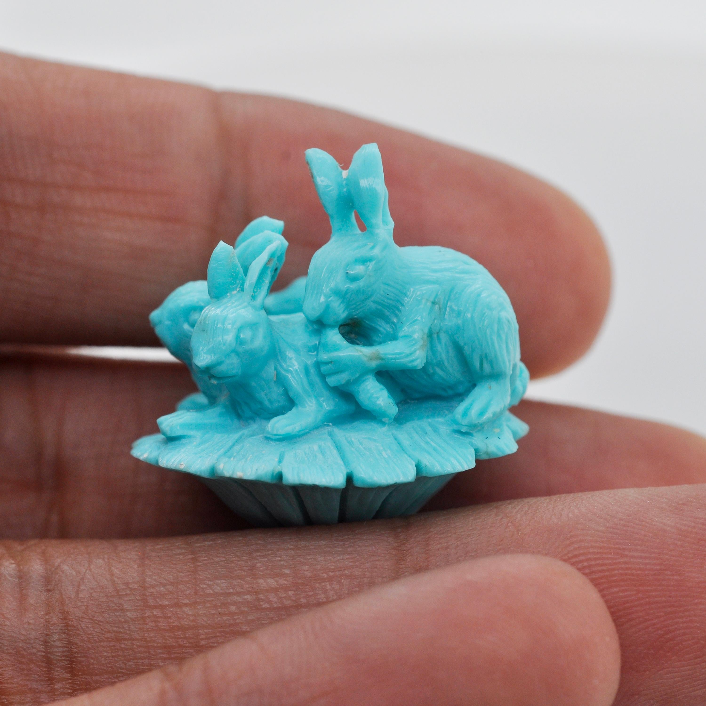 The Hand-Carved 34.97 Carats Natural Arizona Turquoise Rabbit Loose Gemstone is a unique and exquisite piece that showcases the artistry of a skilled craftsman. This particular gemstone has been carefully hand-carved to depict four rabbits in